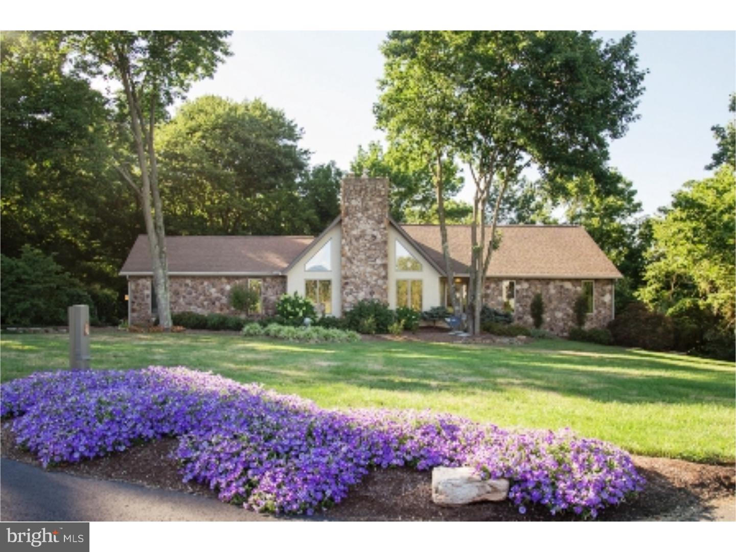 This spectacular contemporary ranch home is situated on a 1.5 acre professionally landscaped site situated at the end of a cul de sac overlooking woods and stream with a pond view! Many custom features! Enter this lovingly maintained residence with a light filled front to back ceramic tiled foyer which include sliders to the rear deck area! The spacious living room features a vaulted ceiling with a stone floor to ceiling propane fireplace perfect for family gatherings! Open concept kitchen with cherry cabinets and island which overlooks breakfast area/dining room with French doors to rear deck area. Current ownership uses this area as a 1st floor family room in lieu of dining room. Laundry room and entry to oversized two car attached garage adjoins the kitchen area. Three bedrooms are located on the main level with an updated ceramic hall bath. The main bedroom features two walk in closets, one with built ins, and a main bath addition, typically not found at this price point, which boasts a generously sized walk in ceramic shower, Jacuzzi tub with windows overlooking woods and a custom dressing area featuring Corian countertops! The enormous walk out daylight basement features a family room with built ins, full bath and separate potential 4th bedroom, currently being utilized as a game room is also located on this level! The finished basement area would be perfect as an in law or au pair suite! Ample storage area exists as well! This is a must see home! Schedule your appointment today!