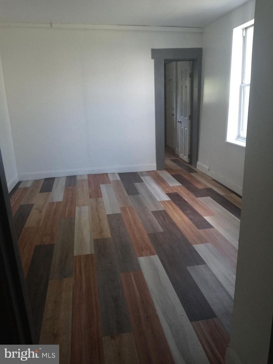 Spacious one bedroom first floor apartment with a nice size yard. Extra storage in a small room in the rear.