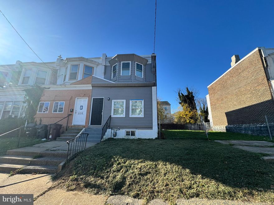 Fully Renovated End-Unit Townhome! Welcome to 606 E 22nd Street in Wilmington, DE — a beautifully renovated 3-bedroom, 1.5-bath end-unit townhouse offering modern style and convenience. Step into the enclosed front porch that leads to a bright, open-concept first floor featuring a spacious living room, powder room, and a stunning new kitchen with white cabinets, black granite countertops, and brand-new stainless steel appliances. A first-floor bedroom just off the kitchen offers flexibility for guests, an office, or additional living space, with direct access to the fenced backyard. Upstairs, you’ll find two comfortable bedrooms and a fully renovated full bath. The home features new luxury vinyl flooring on the main level and plush new carpet upstairs. The entire home has been freshly painted, creating a clean and inviting atmosphere throughout. Move-in ready and located close to downtown Wilmington, parks, and major routes—this home perfectly blends comfort, style, and convenience. Don’t miss your chance to make it yours!