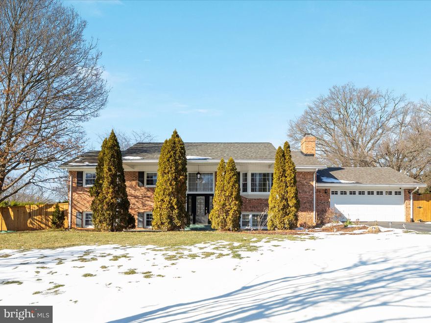 This beautifully updated all-brick split foyer is packed with features! The open kitchen and dining area boasts stainless steel appliances, granite countertops, and white wood cabinetry, leading to a screened-in porch and a sparkling swimming pool. The well-manicured yard includes an irrigation system for both the front and back. The driveway has been expanded to accommodate three cars side-by-side, with additional space for a boat or other essentials.

Inside, the upper level features brand-new hardwood floors, while the lower level is finished with plush wall-to-wall carpeting. Enjoy two brick wood-burning fireplaces—one on each level. The primary suite offers a stunning, renovated bathroom with granite finishes, tiled shower/tub, and a spacious walk-in closet. The lower level has been reimagined to include a laundry/pantry room, a large family room, a hobby room, and two additional generously-sized bedrooms, all with ceiling fans.

The 30,000-gallon saltwater pool is perfect for exercise laps or family fun, complete with a diving board.

Residents can enjoy membership in the voluntary Harbor View Recreation Club.  The association features a marina with slips, dry storage, an ice machine, bathrooms, a tot lot, and options for private parties. Regular community events include Friday happy hours, Sunday brunches, and seasonal Spring and Fall parties with music, food, and fun for all ages.

Located just 5 miles from Ft. Belvoir, this serene peninsula neighborhood offers a peaceful retreat surrounded by woods and water. It’s an active community with neighbors enjoying walks, bike rides, and dog outings.