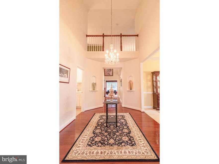 One of the largest and loveliest homes in this Gold Star Rated 55+ Community of Ovations at Elk View with a wonderful corner lot location within walking distance to the clubhouse. From the moment you enter the home, you will appreciate the grand entry foyer complete with beautiful molding details and wall niches to display your treasures, the formal living and dining rooms are just to the right of the main entry finished with beautiful tray ceilings.  A separate full sized office is located directly ahead with lovely views of the deck and back yard.  The chef's dream kitchen is complete with a large breakfast bar, a built in counter depth refrigerator with custom panels to match the cabinets, granite counter tops, a center island, and spacious breakfast area.  The OPEN CONCEPT family room is just beyond the kitchen and is anchored by a gorgeous fireplace with access to the expanded maintenance free deck just beyond.   The main level has a combination of hardwood floors and carpets, custom moldings and trims including decorative columns.  The master suite is adjacent to the office and includes a large sitting room, huge walk in closets, and a spacious bathroom with double sinks, a soaking tub, tile shower, and a separate WC room. The second level features a huge loft area, two added bedrooms and a full bathroom. If you need more space, this home also has a huge unfinished basement with extra high ceilings and an already installed egress window. As a GOLD STAR community, Ovations at Elk View offers a first class lifestyle; relax and socialize at the clubhouse, swim in the wonderful pool, enjoy a game of billiards, maintain your agility at the fitness room, play some tennis, participate in the social clubs, etc. This is the community and the home that you have been looking for!