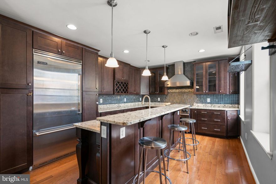 Welcome to this elegantly renovated and furnished end-of-group rowhome, where modern luxury meets classic charm. The gourmet kitchen offers high end amenities and finishes; Viking appliances, granite countertops, tile backsplash and sleek cabinetry with plenty of storage and a breakfast bar. The expansive primary suite boasts a lavish ensuite bathroom, complete with frame-less glass door, rain shower and double vanity. Natural light, coffered ceilings, and exposed brick grace the interiors, while a rooftop deck offers stunning views of both the City and Patterson Park. Two upper-level bedrooms, plus two versatile lower-level rooms, provide ample space. A block from Patterson Park and a short stroll to Canton Square, this furnished residence epitomizes downtown living in Baltimore! Pets will be considered and are case by case. This home is available furnished.