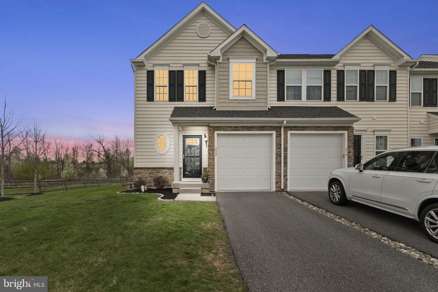 Welcome to 232 Tulip Lane – a stunning end-of-row townhome perfectly situated in Gilbertsville’s desirable Windlestrae neighborhood. This 3-bedroom, 2.5-bathroom home built in 2016 offers everything and more you have been desiring from a low maintenance, luxury lifestyle inside and outside! As you enter the home, you will quickly be able to see why this opportunity is unlike any other you have seen with its combination of space, privacy and convenience! Hardwood floors welcome you as you enter and continue through to the bright and open floorplan, leading to elegant country kitchen. The enormous kitchen features an oversized granite island with seating for 4 people, with granite countertops, subway tile backsplash and an abundance of hardwood cabinets for all of your storage needs! The main floor is the perfect space whether you are entertaining or just enjoying a casual evening, as it opens to the adjacent family room with built-in speaker system and leads to the rear dining room. A modern chandelier rests in the dining room, with a glass slider to the Trex deck which backs up to wooded views! Upstairs you will benefit from a large primary suite, complete with a large walk-in closet and additional second spacious closet, crown moulding, ceiling fan and a luxurious primary bathroom with dual vanity, soaking tub and tiled stall shower. Two more spacious bedrooms – each featuring a walk-in closet and scenic, wooded views – as well as a second full bathroom with shower tub and laundry room complete the second level. In addition to all of this luxurious, finished space above ground, a finished basement still awaits! The finished basement features beautiful LVP floors and recessed lighting, perfect for use as a second family room, playroom, office space or more with additional storage space! The end-unit is conveniently located adjacent to community open space with a spacious side yard and backyard that backs up to wooded space, with the community playground and additional parking also just steps away! Additional parking for two vehicles is available in front of the home or enjoy the benefit of parking inside of a one-car garage with storage. Living in the Windlestrae community, you will enjoy low maintenance living year-round, with lawn maintenance, snow removal and trash included! The prime location in Boyertown Area School District is within minutes of schools, shopping, restaurants and all that New Hanover Township has to offer in addition to lower taxes! Schedule your appointment today!