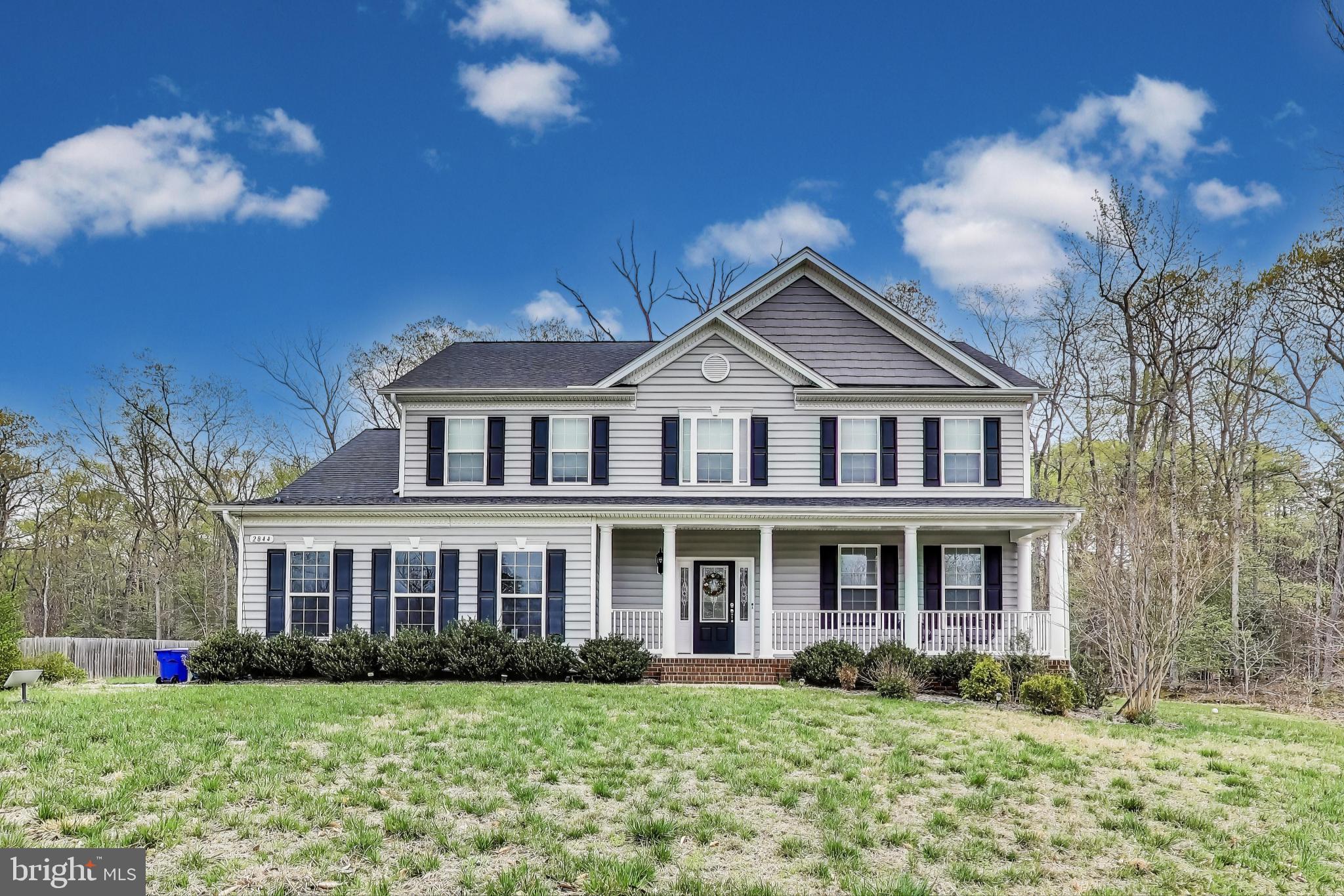Open house canceled for 6/1. Welcome to your dream home, nestled on 1.2 acres in the picturesque Hunter Springs community of Indian Head, Maryland. Built in 2019 by the esteemed Quality Built Homes Inc., this property showcases premium upgrades and meticulous attention to detail throughout.
Spanning over 4,200 square feet across three fully finished levels, this 5-bedroom, 3.5-bath home is designed for both comfort and style. It features a whole-home security system, surround sound hookups in the living room, and a fully finished walk-up basement.
From the moment you arrive, the home’s charming front porch, manicured lawn, and mature landscaping offer outstanding curb appeal. Step inside to a welcoming foyer with luxury vinyl plank flooring that flows seamlessly through the main level. To your right, a light-filled living room with elegant crown molding sets the tone for gracious entertaining. The formal dining room exudes classic sophistication with detailed wainscoting, chair rail, and crown molding—perfect for hosting special occasions.
The gourmet kitchen is a chef’s dream, complete with granite countertops, stainless steel appliances, double ovens, a cooktop, and a large center island. Step out onto the rear deck—ideal for summer barbecues and quiet evenings with serene forest views.
The open-concept layout leads directly into the spacious family room, featuring a cozy fireplace with a stylish mantel—perfect for gathering on chilly evenings. Additional main level highlights include a powder room, a mudroom with access to the two-car garage, and plenty of functional space for everyday living.
Upstairs, retreat to the luxurious primary suite with a grand walk-in closet and spa-like ensuite bathroom, complete with dual vanities, an oversized glass shower, a resting bench, and a soaking tub. Three additional bedrooms, a full bathroom, and a convenient upper-level laundry room complete this floor.
The fully finished lower level offers a spacious recreation room, a fifth bedroom, a full bathroom, a utility room, and extra storage space—an ideal setup for guests, entertaining, or a home office.
Every inch of this home has been thoughtfully designed and lovingly maintained. With its modern upgrades, generous layout, and inviting atmosphere, this stunning property is a must-see. Welcome home!