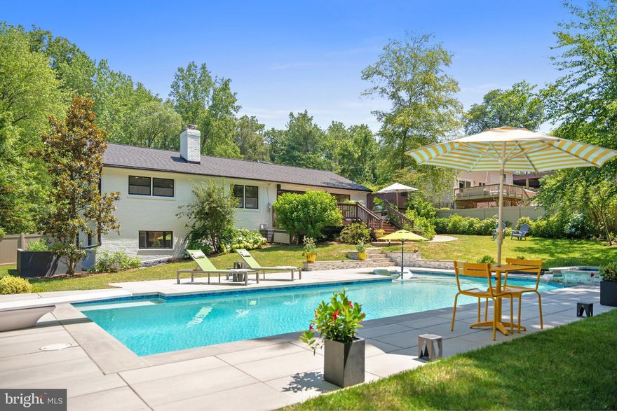 The epitome of resort-style living awaits—complete with a private heated pool and spa, expansive outdoor entertaining areas, and exclusive access to Lake Barcroft for swimming, fishing, and boating. Whether you're hosting a pool party, enjoying a quiet evening under the stars, or heading to the lake, this property delivers a lifestyle that feels like a year-round escape.

Tucked within the coveted Lake Barcroft community, this home offers more than just comfort—it offers a way of life. Lake Barcroft is a 135-acre private freshwater lake set amidst a wooded neighborhood of just over 1,000 homes. Residents enjoy exclusive access to five private beaches with tot lots, boat racks, and lifeguards during the summer months.  Wildlife abounds in the community’s urban forest—foxes, deer, ducks, geese, and even bald eagles call it home. The community fosters a vibrant, close-knit atmosphere with parades, house concerts, numerous clubs, and even its own Independence Day fireworks display.

Thoughtfully updated inside and out, this classic ranch-style home offers effortless indoor-outdoor living. The main level features three bedrooms and two full bathrooms, a well-appointed kitchen, and an open-concept living/dining room. A cozy den with a fireplace and built-in shelves provides the perfect spot for reading or conversation. The dining area opens onto an expansive deck—ideal for grilling, lounging, or hosting summer gatherings. Downstairs, the finished lower level includes a large family room with a fireplace, a half bath, laundry, and abundant storage.

Just 7 miles from Washington, DC, and moments from shopping, dining, and major commuter routes, this home offers natural beauty, everyday convenience, an easy access to the world class attractions in greater Washington, DC.