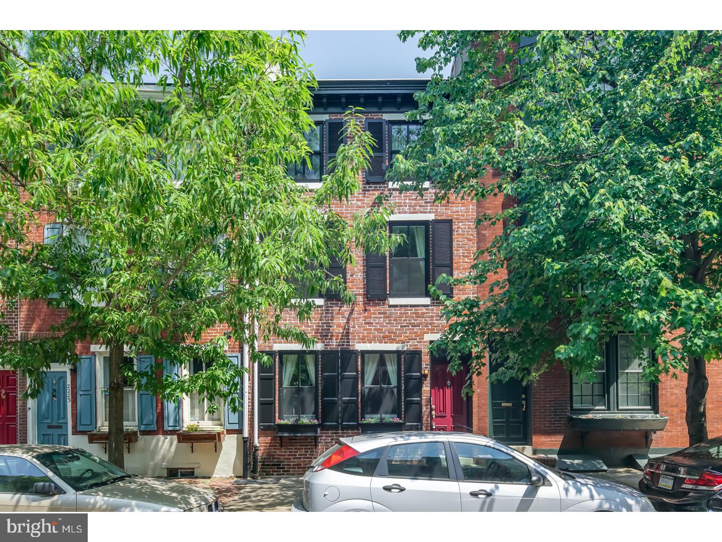 Introducing 2221 Pine, a tastefully renovated home with PARKING in the heart of Fitler Square. This sun-drenched 3 bedroom + den, 3.5 bath, features high-end finishes in every room. From the Chef's Kitchen with maple cabinetry and designer appliances including two stoves, two dishwashers, granite counters and natural stone floors to the finished basement with full bath, laundry and additional storage. The first floor has a slate vestibule that enters into open floor plan living and dining room with crown moldings and wainscoting, two fireplaces and maple hardwood floors. There is a powder room and a beautiful patio that is perfect for dining and entertaining. The skylit staircase leads to the second floor's 2 spacious bedrooms and a full custom designed bathroom. The 3rd floor Master Suite is luxury at its best. It features a walk-in closet, gorgeous stone spa-like bathroom with an enormous shower and whirlpool bath. There is also a separate area for an office or nursery. This upscale home has everything that makes living easy including surround sound, central vaccuum system, dual zoned HVAC, 2 CAR PARKING (compact, or ONE LARGE CAR) and much more all in walking distance to the best restaurants, shops and parks that Center City has to offer.