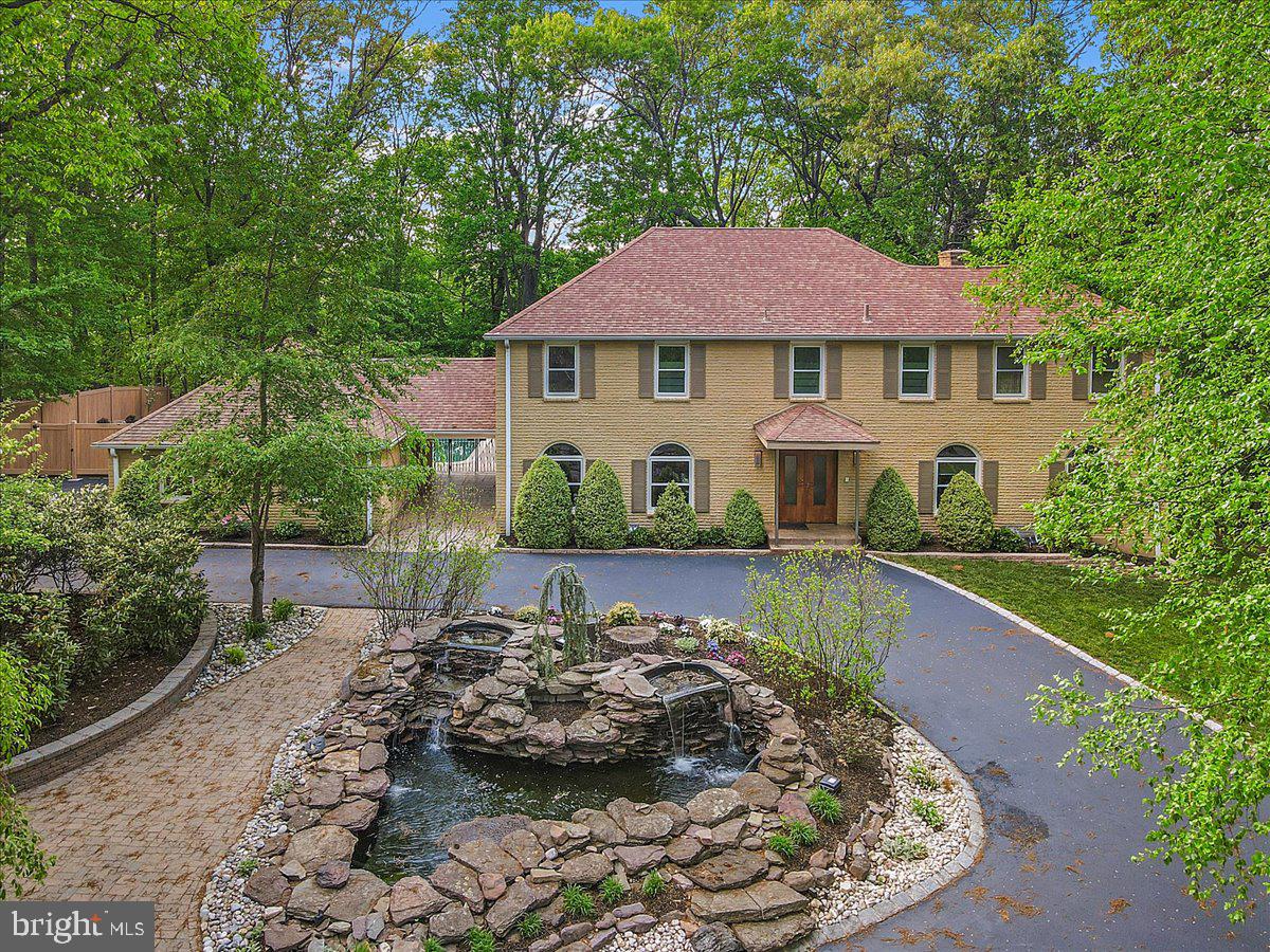 400 Highview Drive – A Distinctive Treehouse-Inspired Luxury Retreat!
This remarkable residence is where luxury, privacy, and nature unite. Nestled in a serene, wooded setting in Upper Merion Township—with the prestige of a Radnor zip code—this nearly 5,000 square foot custom-built home offers a one-of-a-kind lifestyle, masterfully blending modern sophistication with natural beauty.
Designed to blur the lines between indoor and outdoor living, the rear of the home is enveloped in walls of glass, offering uninterrupted panoramic views and creating the serene feeling of a modern treehouse. Programmed exterior night and landscape lighting enhance the breathtaking setting after dark.
Inside, 4,971 square feet of meticulously crafted living space await, featuring high-end finishes, custom millwork cabinetry, and thoughtful architectural details throughout. Rich materials such as granite, maple, anigre, and cherry woods are highlighted alongside custom doors—some with rain glass inserts, others sliding or pocket-style.
The gourmet kitchen is a true culinary showpiece, featuring Sub-Zero refrigeration, Thermador double ovens, a warming drawer, Gaggenau deep fryer, and a Kohler steamer. Dual sinks—thoughtfully designated for prep and cleanup—enhance functionality, while a custom pantry ensures effortless organization. The adjoining family room space is both inviting and refined, with dramatic skylights and a sleek fireplace
that elevate the ambiance.
A dedicated media room redefines in-home entertainment, featuring integrated surround sound, a projection system, and a full-size screen—creating an immersive cinematic experience.
Upstairs the opulent primary suite offers an unparalleled private retreat, crowned by soaring cathedral ceilings and custom cabinetry. The lavish, spa-inspired bath features heated granite floors, His and Her water closets, a grand 6-foot Jacuzzi soaking tub, and an expansive walk-in shower adorned with body sprays, handheld and rain shower heads, and an integrated steam sauna system — all thoughtfully designed with the flexibility to convert into two full bathrooms if desired. A magnificent walk-in closet, generously proportioned to accommodate a fifth bedroom conversion, enhances the suite’s versatility. Additional indulgences include a beautifully appointed vanity, a discreet laundry chute, and custom built-ins housing a mini-fridge and microwave — perfect for enjoying late-night refreshments in complete comfort and style. Additional accommodations, on this level, include three generously sized bedrooms each thoughtfully designed with peaceful views, abundant natural light and ample closet space and a second bathroom with heated marble floors and custom cabinetry.
The fully finished walkout lower level provides exceptional versatility, featuring a private fifth bedroom, a full bath with jacuzzi tub, kitchenette, and an expansive flex space ideal for a home gym, studio, or additional living area - perfect for extended stays or multigenerational living.
Step outside to experience resort-style living: a 40' x 24' in-ground pool surrounded by Ipe wood decking, a sleek cabana with a full bathroom for added convenience, and a fully equipped outdoor kitchen—perfect for seamless entertaining. *Cabana full bath is the main floor full bath noted in rooms.
Smart home and mechanical upgrades include:
* Lutron light control system
*Central vacuum system
*Advanced security system with exterior cameras
*7-zone irrigation system
*175 recessed downlights throughout
*3-zone heating and cooling system
*400-amp, surge protected, electrical service
*Full-house generator
*1,000-gallon underground propane tank with hard line connections.
Ideally situated just minutes from award-winning schools, world-class shopping, and major highways, 400 Highview Dr delivers a unique blend of natural beauty, modern luxury, and extraordinary convenience.
This is not just a home—it’s a lifestyle!