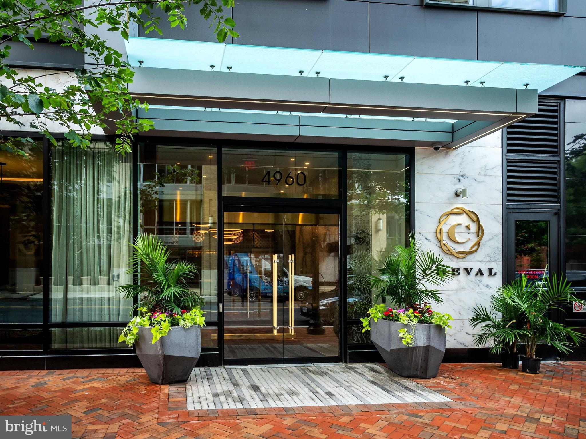 Situated in the heart of downtown Bethesda, this exquisite three-bedroom, two-and-a-half-bath condo is located in the Cheval, a pet-friendly boutique building with countless amenities. This unit highlights stunning sunsets and features an open floor plan that is flooded with natural light. The gourmet eat-in kitchen features high-end stainless steel appliances and an island with seating, and opens to a charming dining area with access to a private balcony. The spacious living room is sure to impress with beautiful floor-to-ceiling windows. This unit offers three bedrooms and two full bathrooms including the primary suite with a custom walk-in closet and spa-like bath with a double vanity, walk-in shower, and separate soaking tub. Completing this condo is a powder room, separate laundry room with ample storage and two assigned garage parking spaces. The Cheval is situated in a wonderful urban environment in close proximity to the Metro and all downtown Bethesda has to offer. Building amenities include an elegant lobby with 24-hour concierge, a club room, an expansive rooftop, and a private fitness center with a separate yoga studio.