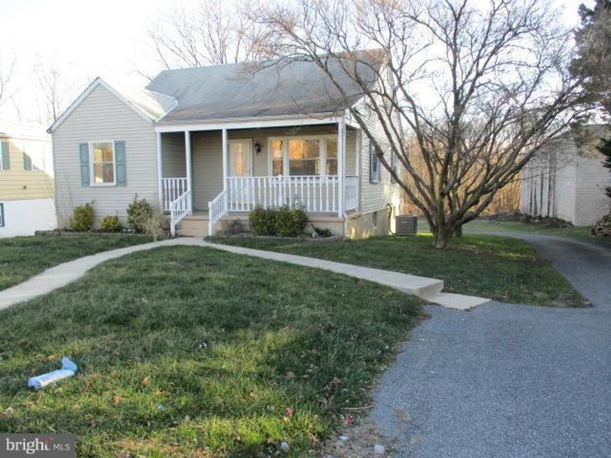 Spacious Cape Cod. Previously remodeled kitchen with oak cabinets, some newer appliances, finished wood flooring and newer counter tops. Separate living and dining rooms with hardwood floors. Lower level with  full bath, family room, laundry and workshop areas. Upper level features hardwood floors, ceiling fans in all 3 bedrooms & remodeled full bath.