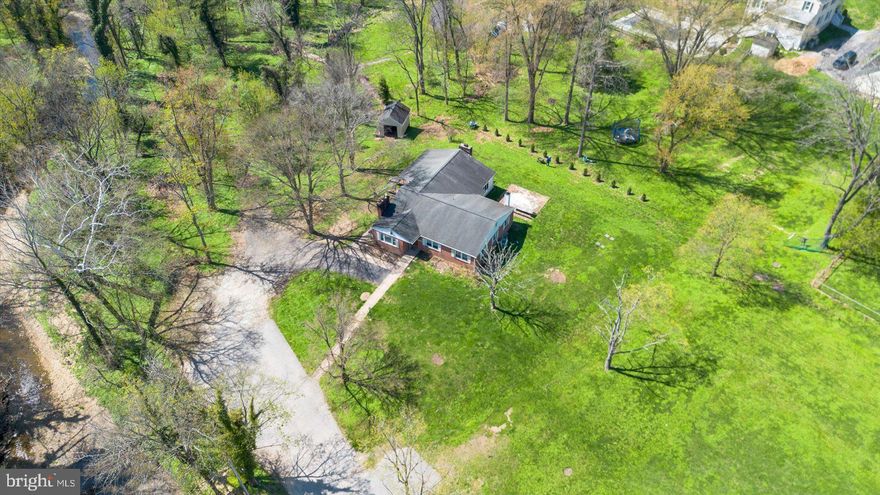 Once-in-a-generation opportunity in Towson with over 1 acre across four contiguous lots—ideal for creating a private family compound, multi-generational living, or future development. The main residence at 1701 Roland Ave is a solid brick rancher featuring 3 bedrooms, 3 full baths, a finished basement, and an open-concept kitchen, dining, and living space. Set on a 28,314 sq ft lot, it offers both comfort and flexibility.
1703 Roland Ave includes a detached 3-bay garage with a separately metered 2-bedroom, 1-bath apartment above—perfect for rental income, guest quarters, or extended family. This parcel adds an additional 16,116 sq ft. The sale also includes two additional undeveloped lots (38,916 sq ft and 4,532 sq ft), bringing the total land to over 1 acre in a prime Baltimore County location just minutes from shopping, dining, and major commuter routes. Endless possibilities. Rare scale. Prime location. Sellers are highly motivated—easy to show.