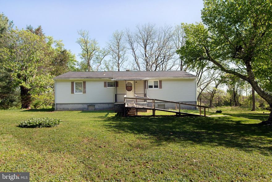 PRIDE OF OWNERSHIP.....This home is clean and ready for you.  Move in and add your personal touches.  Beautiful lot with two out buildings. Country living for all.  This home offers a very large kitchen.  The huge great room with a brick  fireplace  will be enjoyed by all.   Enjoy the beautiful hardwood floors .   The lower level offers multi rooms and awaits your imagination. The furnace was replaced at the end of 2024. Close to shopping and yet in the country.  Ramp at front door can be removed if you wish.  
Come look and buy!!!!  This is an Estate Sale and is being sold AS-IS, Buyer responsible to confirm zoning