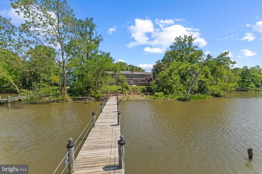 Resort living all year long. Come make your life a vacation at 8730 Stockton Parkway. This one-of-a-kind custom contemporary home sits on .66 premier waterfront acres with a private dock. 17ft floor to ceiling windows captivate the serene tranquility this home has to offer. Every room boast it’s own private deck overlooking the water. Custom built with post and beam construction,  cedar siding and 9 inch thick walls. 
 The perfect home to gather with an intimate group or host a large scale event. Your dream life is here! Main level living, 2019 custom kitchen renovation, screened porch, Trex decking, ample flex spaces to adapt to your lifestyle, 2023 primary bathroom renovation with  marble, sauna and heated floors, 4 oversized upstairs bedrooms, roof replaced , 2 new  gas tankless hwh, replaced 2 Hvac  and so much more.  Channel to potomac will accommodate up to a  45 ft boat and mast height under bridge is 22 ft.