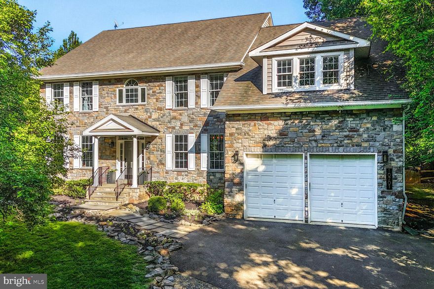 Welcome to 10701 Hunting Lane in Rockville.  One of three stunning stone front, custom residences nestled among half acre+ homesites in the Wootton school district.
Featuring 4 spacious bedrooms, 2 bonus rooms, 4.5 luxurious bathrooms, a dedicated home office, a stylish mudroom and laundry room for added convenience, and expansive living areas.  This home has undergone exquisite renovations and is poised to redefine luxury living.   The beautifully situated homesite is surrounded by serene landscaped grounds, lined with mature trees creating a private retreat for relaxation and/or play; The front and back yards are perfect for both entertaining and/or quiet living.   Upon arrival, enter into a 2 story welcoming foyer with a wrought iron double sided staircase, formal living and formal dining rooms, a custom-designed office with built-ins, and a roomy half bathroom.  Take pleasure in the captivating gourmet kitchen, a haven for an aspiring chef & an entertainers dream.  Featuring the finest in custom cabinetry & sleek countertops (Soapstone), a grand island, top of the line appliances including a 6 burner gas stove, 2 ovens, a built in microwave, and extra beverage and wine refrigerators.  The flow is seamless right into the generous sized family room featuring 10 ft ceilings & oversized windows, filling the home with an abundance of natural light.  A floor to ceiling Stone gas fireplace adds character and sophistication.   The delightful screened in porch allows for year round outdoor living with 2 built in heat lamps, adding even more warmth and charm to a perfect place for family gatherings and/or quiet nights in; Truly an outdoor oasis of your own awaits with a fire pit overlooking a lush, picturesque yard.   The entire home is enhanced by meticulous detail, gleaming hardwood floors throughout (minus the upstairs bedrooms) to elegant and modern light fixtures, high-end craftsmanship on every level.  Upstairs, the expansive owner's suite serves as a private retreat, complete with a spacious sitting room and  a 2 sided gas fireplace, 2 capacious & custom built walk-in closets and a spa-like en-suite bathroom. Prepare to be amazed by the luxurious bathroom featuring modern tile accents, an oversized walk-in glass-door shower, 2 sinks/vanities, a soaking tub and a separate make up vanity.  The upper level also includes 3 unusually large additional bedrooms, all with vast walk-in closets with custom built in shelving and drawers, and two well-appointed full bathrooms (one shared).  The fully finished lower level provides 2000+ more square feet of versatile living space. Whether you're hosting movie nights, enjoying games, or working out, this space is a perfect mix of function and flexibility. It includes 2 oversized Recreational Rooms, one of them being perfect for a personal dance studio, playroom or gym. This level also features 2 additional Bonus rooms and a full bathroom in between the two, providing ample space for guests, extended family, or multi-generational living.   Situated in a prime location, this home offers convenient access to major commuter routes, parks, recreational amenities, and prestigious golf courses. It is also within reach of top-rated Montgomery County schools.   Don’t miss your chance to own this extraordinary home.  A must-see,  this 7000 square feet of meticulously crafted living space, showcases the finest finishes throughout an exceptional floor plan.