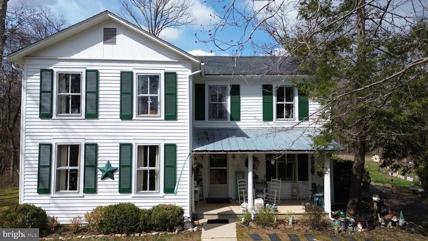 This captivating property offers a unique blend of rich history, modern convenience & ample space for your dreams. Explore the grandeur of a bygone era with the home's classic architecture & slate roof. Step inside to find a haven of spaciousness, with 4 bedrooms, 1.5 baths & 9ft ceilings throughout. Immerse yourself in the warmth of heart pine flooring that flows seamlessly across the expansive rooms. Built-in shelving adds a touch of sophistication & provides versatile storage solutions. Relax on the covered porches soaking in the quiet & nature. During the summer enjoy the comfort of central air conditioning upstairs. 
Two staircases enhance the home's flow & functionality. Unwind on the expansive 13-acre property, offering the potential for subdivision (verify). A charming springhouse adds a touch of historical intrigue to the grounds. Fiber optic internet keeps you connected while the serene setting, less than a mile from the James River, provides a welcome escape. Several outbuildings, including a 1.5 car garage, offer additional storage or workspace, while the absence of an HOA frees you from restrictions.
This remarkable property is more than just a house; it's a chance to own a piece of history & create lasting memories.