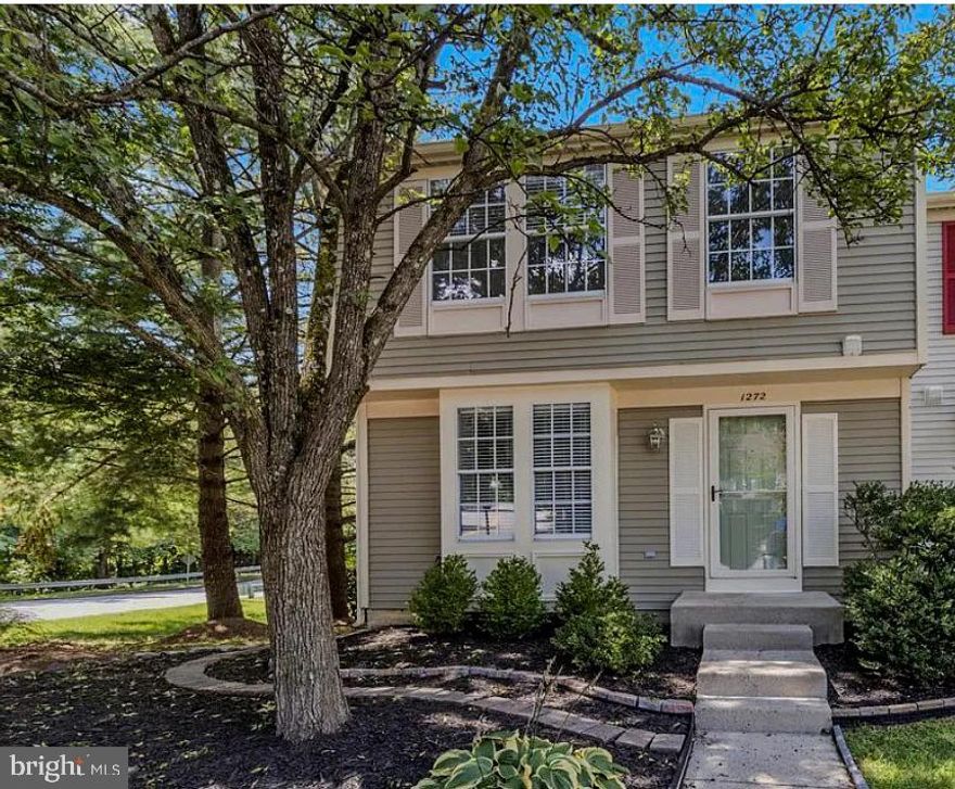 Welcome to 1272 Seminole Drive, an end-unit townhouse tucked among the trees in The Bluffs at Deep Creek in Arnold. This location offers quick access to College Parkway, making trips to Annapolis, Baltimore,
Washington D.C., and the Eastern Shore incredibly convenient. The neighborhood includes sought-after amenities such as a community pool, basketball courts, and a playground. Step inside to a bright, generously sized living room featuring a newly added electric fireplace, modern recessed lighting, and the convenience of a newly installed stackable washer/dryer. The adjoining kitchen offers an inviting eat-in dining nook, and the space was recently refreshed with a custom wood accent wall and updated appliances.
   Upstairs, you'll find three bedrooms and a full bathroom.Brand-new carpet enhances the staircase, and the upper level features recently installed waterproof vinyl flooring throughout.
   The lower level offers true studio-apartment potential with its own washer/dryer, full bathroom, and a newly added kitchenette complete with new cabinetry, sink, faucet, garbage disposal, induction cooktop, microwave, refrigerator, and stylish backsplash. The space is finished with recessed lighting, an electric fireplace, and new vinyl flooring, making it ideal for guests, extended family, or rental use.
   Outdoor living is just as appealing, with a spacious deck off the kitchen and a covered patio below with direct walkout access from the basement. The fully fenced, low-maintenance yard feels private and serene, enhanced by thoughtful landscaping.  
   Don't miss this gem, schedule your showing before it's gone!
