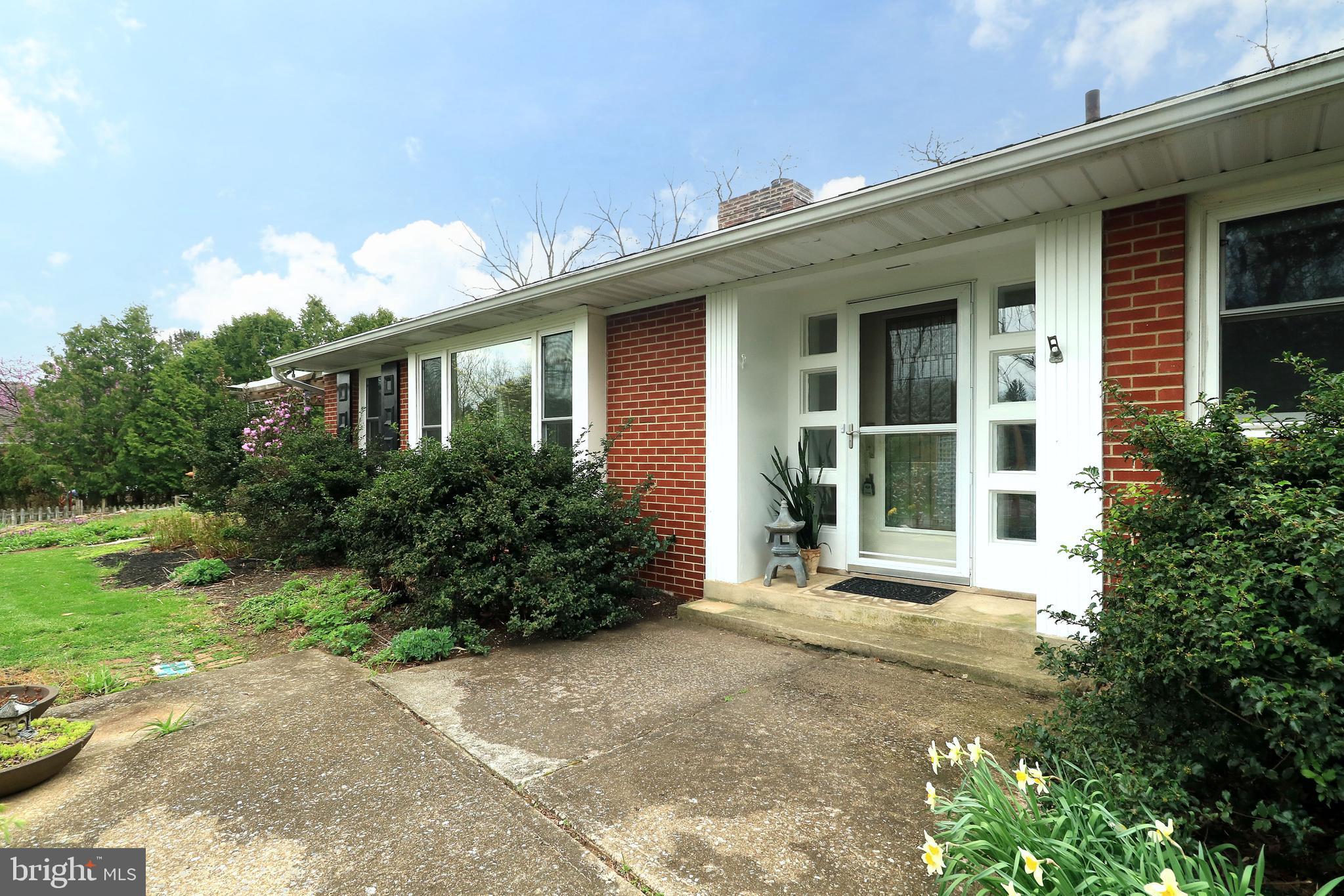 Have you been seeking the sense of peace that comes from a large private lot but don't want to lose the convenience of in-town living? Come and discover a rare blend of indoor and outdoor living that celebrates the beauty of nature and joys of life all year round at 531 Kennard Road, State College. This 3 bed/2 full bath 1950's updated U-shaped ranch home is nestled on a serene 0.89 acre lot with mature trees, wonderfully planned out perennial gardens that bloom throughout the seasons attracting birds and pollinators, a fabulous private courtyard with live bamboo grove that creates an oasis like feel, and rolling open lawn area. Inside you'll find a thoughtfully updated home with hardwood floors and wonderful windows that allow the natural light to filter gently in. Spend cozy evenings in the spacious living room featuring a ventless gas insert fireplace with stylish mantle, and lovely built-in shelving. This is a great home for entertaining starting with the beautifully updated vaulted dining room with heated tile floors and sliding door to the front stamped concrete patio with pergola, a fabulous place for a warm summer evening supper. Prepare meals that will dazzle your guests in the updated kitchen with granite countertops, abundant well appointed modern wood cabinetry, Bosch stainless steel appliances, 5 burner gas cooktop with hood, wall oven with warming drawer, tile backsplash, pantry cupboard, large pull up island with deep sink, built-in desk, and a door to the deck. Host a monthly book club or set up your art studio in the wonderful vaulted sunroom with skylights, tile floor, 4 sliding doors to the deck, and gas line hookup if the next owner would like to add in a gas stove. Throw swanky parties in the bamboo lined courtyard with composite decking, integrated live tree, huge pergola, built-in planters, two sided wood burning outdoor fireplace, and electric hookup for a future hot tub. At the end of a long day slip away to the spacious primary bedroom with big windows, sliding door to courtyard, and two closets. A second bedroom with built-in bookshelves shares the cute hall bath with tub/shower combo and tile floors. The spacious front ensuite features two closets and a private bath with tile floors, corian topped large vanity, and glass door walk-in shower! A large laundry room with lots of closet space and door to the courtyard completes the interior of the main house. You'll appreciate having an attached 2 car heated garage with attic pull down and central vacuum system. If you work from home or are a hobbyist, you'll love the detached office located just off of the courtyard with a separate walkway from the driveway, heated and air-conditioned, this space provides endless opportunities for your small business needs. It also has a root cellar access for additional storage. Lots of space for gardening tools, hobby set up, and lawn projects can also be found in the detached 2 car garage with separate 220V electric panel that can accommodate car work or building equipment needs. With a fenced garden area you'll be ready to set up your own little homestead. The Buyer of 531 Kennard Road will also be granted first right of refusal to purchase additional 0.80 acre adjoining lot (parcel #25-003A,035B,0000-) to maintain the sweet privacy and space for outdoor activities and play! Located just 4 miles to Beaver Stadium and 3 miles to the Old Main Gates, you'll love the quick and easy commute to campus or town. Also, don't miss exploring sweet historic Boalsburg with the weekly farmer's market, annual People's Choice Festival, and grand Memorial Day Weekend celebrations. There is much to love in this special home, come and take a look today!