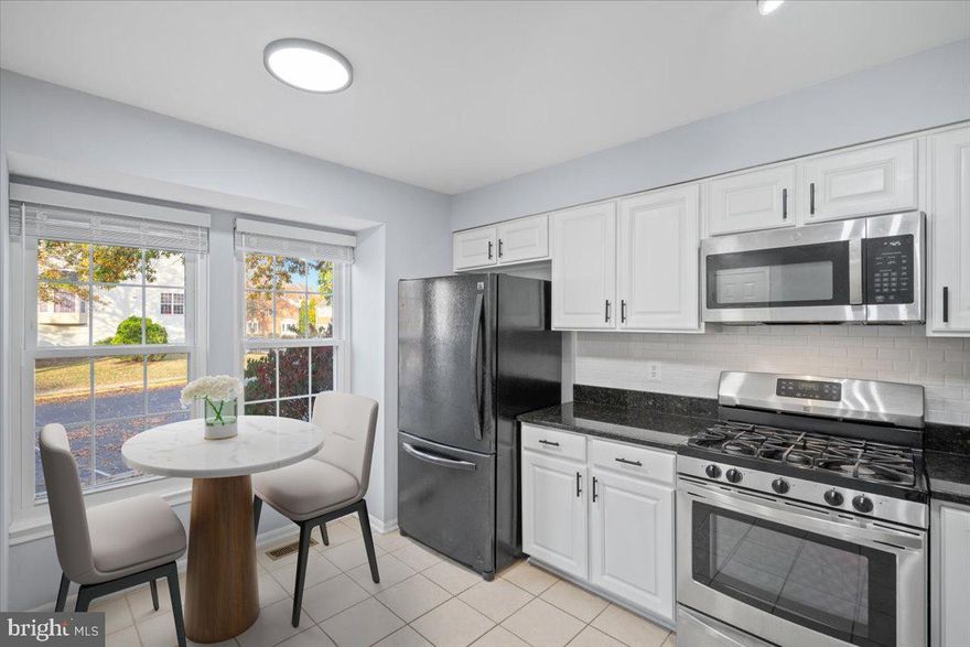 Price Just Improved! Welcome to this stunning end unit townhouse, a true gem in the sought-after Kingstowne community! Nestled against a backdrop of serene woods, this home offers privacy and tranquility, perfect for those seeking a peaceful retreat. Experience light-filled rooms with abundant windows on three sides of the home. Upstairs, there are three generously sized bedrooms with abundant natural light, vaulted ceilings and a skylight. Enjoy cooking in a stylish kitchen equipped with white cabinetry, updated appliances, and luxurious granite countertops. Elegant hardwood flooring graces the majority of the main level, adding warmth and charm.
Stylish (and NEW in living room) hardwood flooring graces the majority of the main level, adding warmth and charm.  Step out onto your expansive deck from the living room, perfect for outdoor entertaining or simply enjoying your morning coffee while surrounded by nature.

Downstairs, enjoy a finished Walk-Out basement, a versatile space featuring a separate entrance, ideal for a 4th bedroom, guest suite, or home office. This home is designed with plenty of storage space throughout for your convenience.

Take advantage of the fantastic community amenities, including a swimming pool, fitness center, and scenic lake, all within walking distance. Enjoy a variety of shopping and dining options nearby, making everyday living a breeze.

A prime location situated just outside the beltway, this townhouse is conveniently located near Franconia-Springfield Metro, Old Town Alexandria, Amazon HQ2, the VA Tech Innovation Campus, the Pentagon, DC, Fort Belvoir, and Andrews Air Force Base. Commuting has never been easier!

Don't miss the opportunity to own this charming townhouse in a prime location! See Virtual Tour and Floorplans.