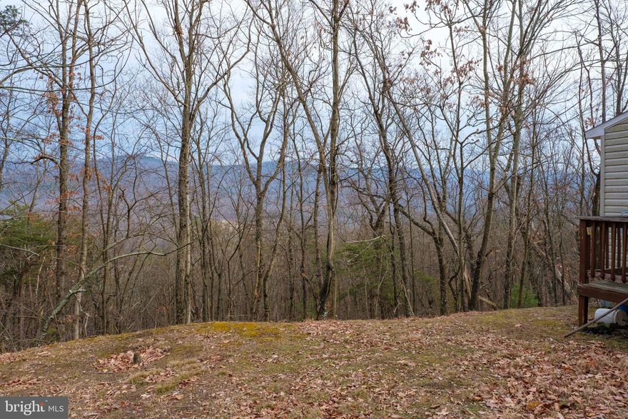 Hunters paradise with nestled on 33.73 acres on a dead-end lane near the WV/VA State Line.  Shed/Cabin with electric is at the property being sold as is, where is.  Enjoy ATV trails, hiking, hunting, and all that Mother Nature has to offer. Recent survey on file. Within 30 minutes of Broadway VA and Wardensville WV. Convenient to Lost River State Park and Kimsey Run Lake. SHOWN BY APPOINTMENT ONLY - NO DRIVE BYS.