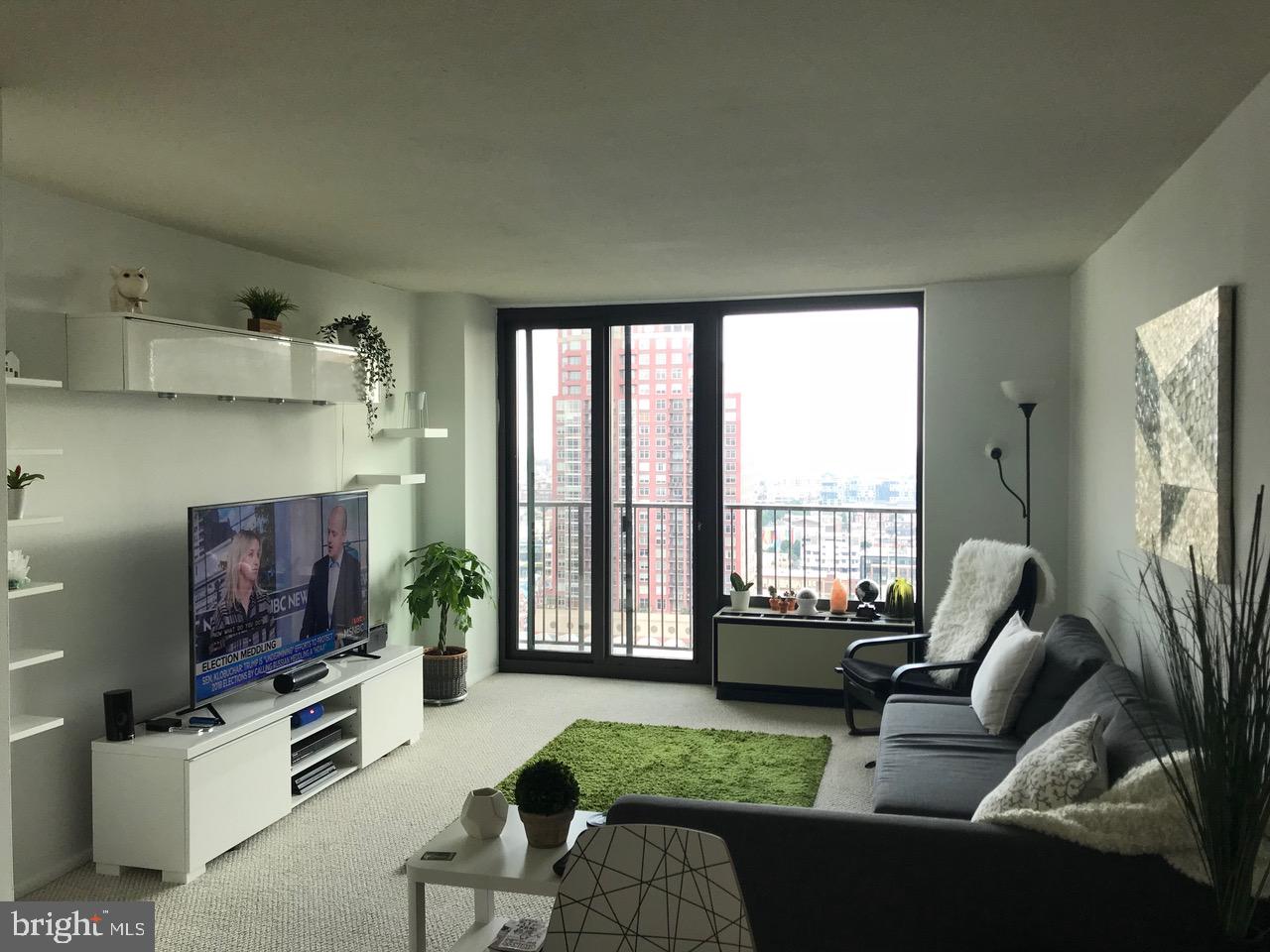 One bedroom on a high floor showcasing southern cityscape vistas. The home features ample entertaining space due to a generously combined living/dining room which provides access to a private Juliet balcony. Adjacent, there is a bedroom that enjoys use of two walk-in closets and a large ensuite bathroom with an oversized single vanity, shower/tub and washer/dryer. Additionally, the home boasts a separate and well-equipped kitchen with tile floor and white appliances. Academy House enjoys a coveted Avenue of the Arts address, located three blocks from Rittenhouse Square and close to public transportation. Residents enjoy a brand new indoor pool and state-of-the-art fitness center as well as the option of valet parking, and a 24-hour doorman.