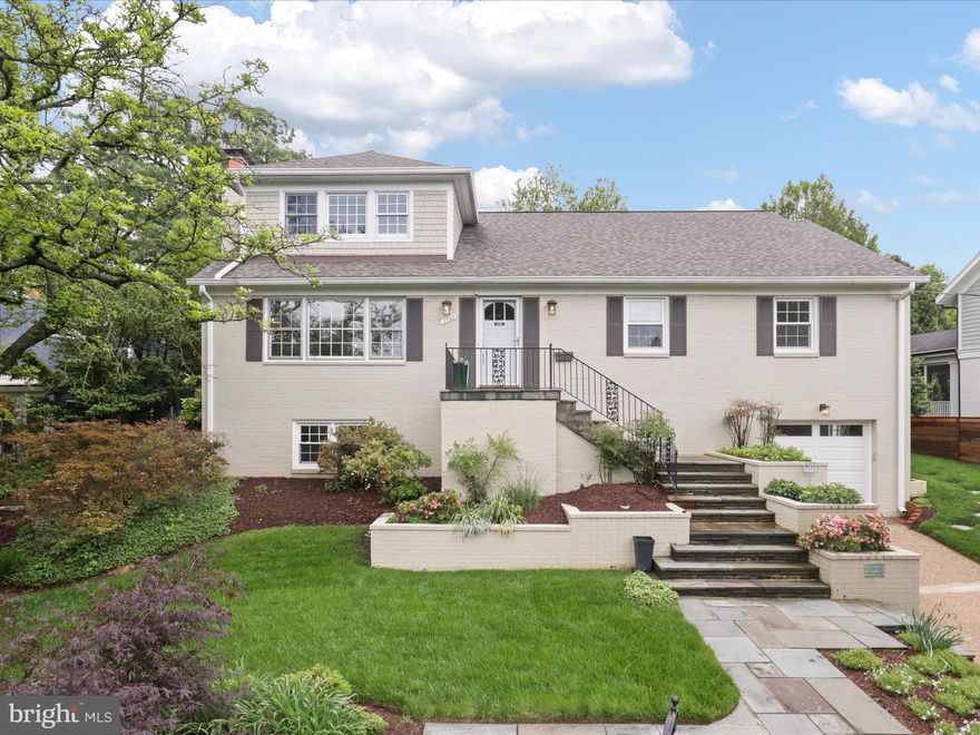 Beautifully expanded and meticulously maintained 4BR/3BA home in sought-after Country Club Manor. Nestled on a quiet, tree-lined street, this home blends timeless charm with thoughtful modern updates across three spacious levels. Main level features white oak floors, an oversized living room with brick fireplace, formal dining room, and updated kitchen with custom cherry oak cabinetry, granite counters and stainless steel appliances—plus access to an expansive rear deck.

The upper-level addition boasts a luxurious primary suite with tray ceilings, spa-like bath, and a private balcony overlooking the professionally landscaped yard. A Deluxe Office/Studio/Bedroom completes the upper level. Lower level offers a rec room with wood-burning fireplace, full bath, ample storage, and access to an oversized one-car garage with a level 2 EV charger.

Major updates include new roof, HVAC, furnace, and water heater (2024). Minutes from the GW Parkway and Chain Bridge! A rare find in one of North Arlington’s most desirable neighborhoods!
