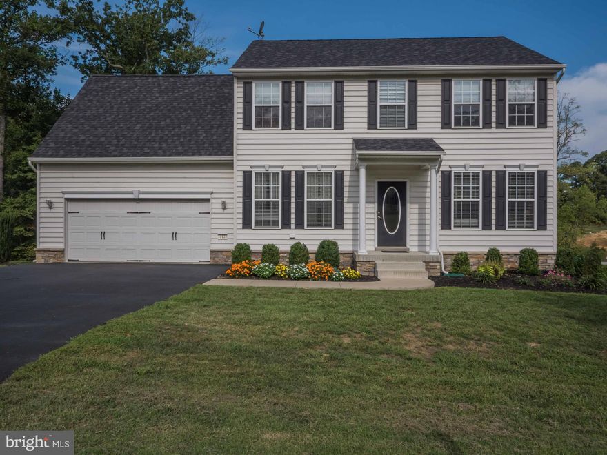 Gorgeous 3 level Colonial w/ all the upgrades w/over 3000 total sq ft.  Hardwood, 9ft ceilings, gas fireplace, chef's kitchen w/center island & breakfast bar, granite, separate dining rm, study w/glass french doors,  cathedral ceiling in master & 4th b/r, upgraded carpet & padding, custom blinds, recessed lighting, landscaping, tots playground, composite decking on almost 1 acre. Tots playground.