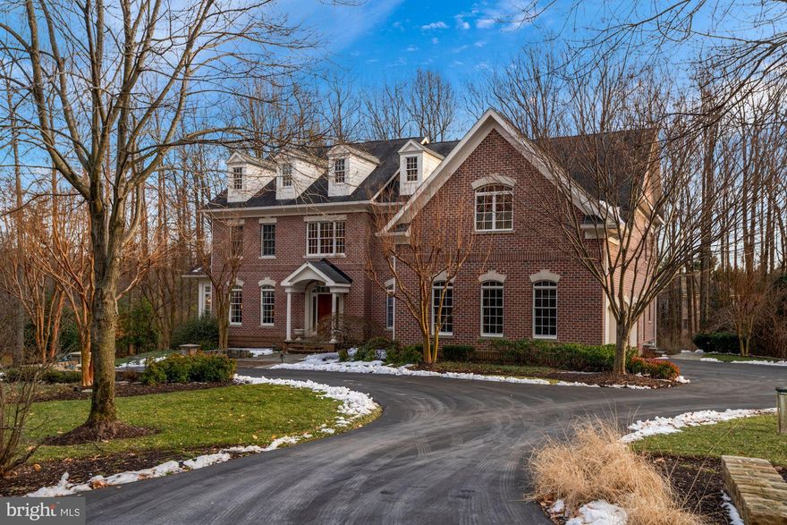 Welcome to luxury living at The Pindell Woods, one of Howard County’s most exclusive and sought after communities. This home features nearly every amenity you could imagine with an impressive attention to detail. With over 6000 square feet of beautifully finished space there is plenty of room for even the most avid entertainer! The first and second level boast gorgeous wide plank cherry wood floors that are both warm and elegant. The sprawling kitchen is appointed with everything a professional chef could wish for. With a Thermador gas stove and top of the line Kitchen Aid appliances cooking is a delight. The natural light pouring into the main level glimmers off of the oversized island and granite countertops. Don’t miss the butlers pantry between the kitchen and formal dining area! The inviting living room has floor to ceiling windows and a double sided gas fireplace which also serves the attached office. There is plenty of room for all of your books in the office’s many built in bookshelves! Tucked away in the back of the main level is the perfect place to read a book or have a coffee, an exceptional sunroom covered in shiplap and surrounded on three sides by large windows! Be sure to check out the tumbled marble tile in this room! Take the stairway off of the two story entry foyer to the bedroom level. (Note the beautiful chandelier can be lowered for cleaning at the flip of a switch!) At the top of the stairs you’ll find a spacious upper level family room perfect for relaxing! Turn left to find two large bedrooms with a jack and jill bathroom perfect for the kids! Don’t worry about lugging laundry up and down the stairs as this home features a full sized laundry room on the second level! The generously sized guest room has its own well appointed bathroom and plenty of light! Open the double doors to the master suite which features its own gas fireplace, vaulted ceilings, two huge walk in closets and a grand master bathroom with green-heated tile flooring straight out of a spa! The fully finished basement is an entertainer's dream! With french doors leading to the backyard and full sized windows you will forget you’re on the bottom floor! This level features a full bathroom, wet bar, theater room and an additional bedroom! In the storage area there is plenty of room to store all of your holiday decorations and just about anything else! Backing up to a wooded nature preserve and sitting on a gorgeous 1 acre lot with professional landscaping and a koi pond, you will forget you are minutes from Routes 32 and 29! With a custom built putting green you won't need to leave the property to practice your short game! After your easy commute home, pull into one of three side entry garage spaces. Some bonus features include solid wooden doors, crown molding throughout the home, central vacuum and an oversized mudroom with built-in shelving and plenty of coat hooks! This is an exceptional property that can only be appreciated by scheduling a private tour today!