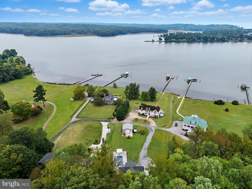 SUPER DEAL REDUCED $150K -dock, pool, acreage, garage****shows like a model home!! This custom-built 2019 home is a waterfront treasure offering absolutely stunning views of both the Potomac Creek and the Potomac River from every room. With serene vistas and luxury living, this residence is a true retreat. Step inside to find gorgeous pine hardwood floors throughout, vaulted ceilings in the family room, and floor-to-ceiling windows that frame the breathtaking scenery. The back of the house features a gorgeous deck and a stone patio below, which is pre-wired for a hot tub. Plus, there’s a heated in-ground gunite pool with a custom cover—perfect for relaxing or entertaining. The basement has an additional room which could easily be a 5th bedroom.  There is also a huge rec. room with full bar!!!  Outside, you’ll love the two-car detached garage and the outdoor cooking station complete with a grill and ice machine. Boaters will appreciate the shared dock with a 13,500-pound boat lift, easily accommodating a 30-foot boat. And if you love fishing and wildlife, this spot is a dream come true—quiet, serene, and with no HOA to worry about.  Conveniently located just 12 miles from the Virginia Rail Express at Leland Station, you have easy commuter access to D.C., with trains starting as early as 5:30 a.m.  In short, this is truly a must-see property that combines luxury and nature seamlessly. It doesn’t get any better than this!