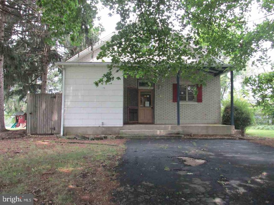 Cape cod home with thick brick walls to keep the house cool in the summer, charming front porch. Floor to ceiling stone fireplace in living room. Vaulted loft with hardwood floor and skylight.