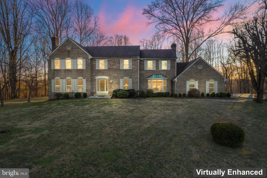 JUST REDUCED THE PRICE!
This home has now been freshly painted, hardwood flooring refinished and the carpeting replaced.      This idyllic Potomac center hall colonial is the one you’ve been waiting for! This gorgeous, sun-drenched residence boasts 5 upper-level bedrooms and 4.5 bathrooms with story book curb appeal on a private 3-acre parcel backing into wooded streams and trail access. The interior tastefully blends traditional and classic architectural features with modern amenities and design elements with hardwood floors on the main and upper-level hallway.  The inviting front entry hall seamlessly guides visitors to the formal living room featuring wood burning fireplace, beautiful mantel with dentil molding and recessed lighting. The spacious dining room easily accommodates a 10-person table while remaining light and airy with a view of the expansive property. 

 The flow of the main level is very desirable and versatile offering an office with French doors to the right of the foyer. An expansive great room (adjacent to the renovated kitchen) with stone fireplace and entrance to private deck through a triple sized sliding glass door.   

The renovated kitchen boasts beautiful granite countertops, stainless steel appliances, informal dining area, tile backsplash and walk in pantry. 

 The upper level features a stunning primary suite with a comfortable sitting area, large walk-in closet, additional closet, spa-like renovated bathroom with dual granite topped vanities, frameless glass shower and soaking tub!  There is an additional expansive en suite bedroom with bathroom. Three additional large bedrooms share a third fully renovated hall bathroom.

The massive lower level captures excellent natural light with full size window, at grade walk out access and a renovated full bathroom, recreation area, gym space, ample storage and mechanical area. 

The HVAC equipment is approximately 3, 2 and 1 year old depending on location.     

 Prime Potomac location offers convenient access to River Road and Travillah Road providing convenient shopping and dining options along with access to major commuting routes.  The Rivers Edge Community has three trails leading to the C&0 Canal’s towpath for exploration and adventure. This home sits at the end of a blooming treed cul-de-sac and backs to the Potomac River.      Welcome Home!