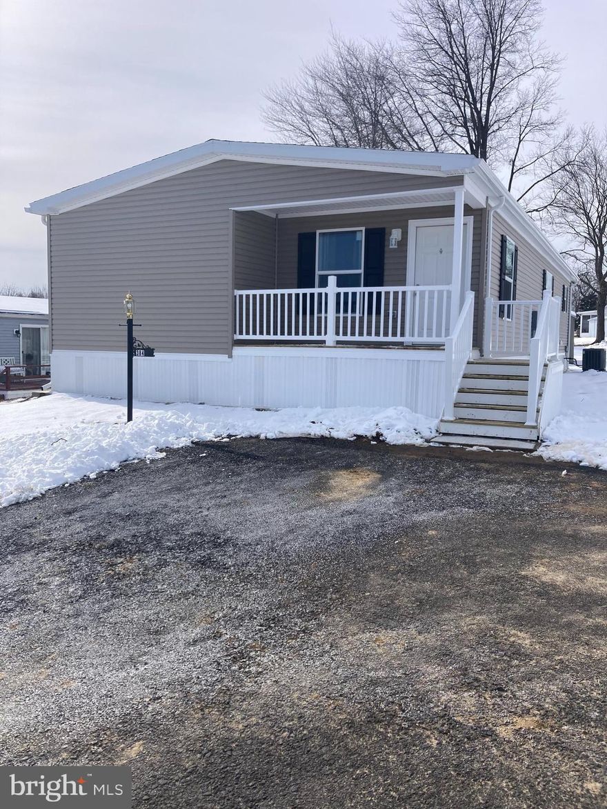 A brand-new construction, energy-efficient, 3 bedroom/2 bath home is now available in the 55+ Village of Neshaminy Falls! Enter your two-car dedicated parking space, up a few steps, and onto a covered porch great for gazing out at the neighborhood.  A spacious living room with an overhead ceiling fan greets you as you enter the home.  Marvel and the huge kitchen with an island, many cabinets, and counter space that includes all major appliances.  Across from the kitchen is a room suitable for dining/family or an office space.  Towards the rear of the home is the primary bedroom with a bathroom and a shower stall.  The additional two bedrooms are in the front of the home separated by the guest bathroom.  The mudroom/laundry area with additional storage space is just off the kitchen.  The mudroom leads to a rear exit with steps to an 8x8 storage shed.  The rear of the home has a nice open space.  Get ready to put your offer in after you see this home!