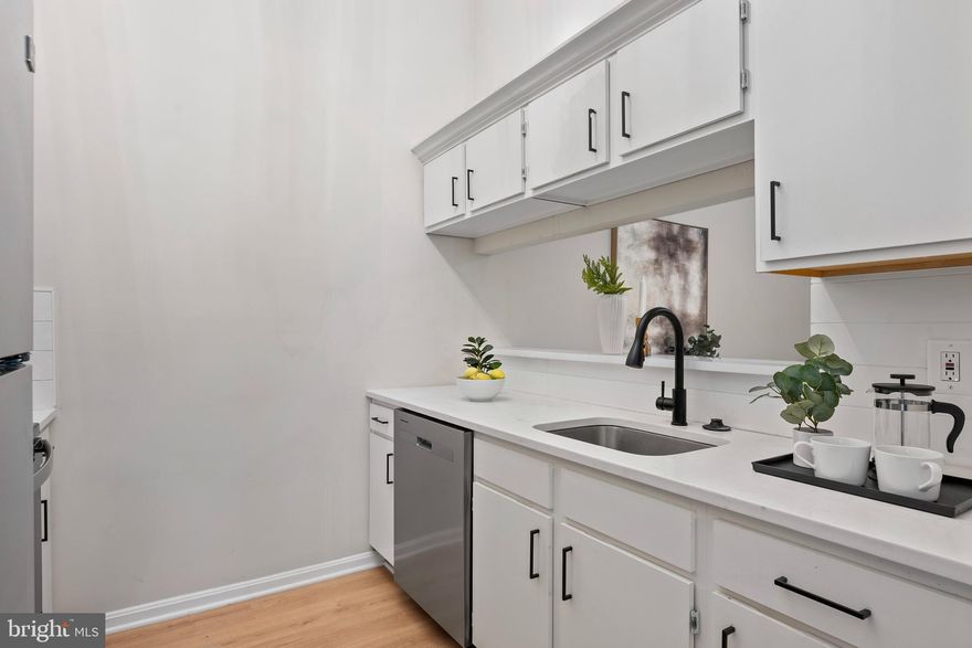 Welcome to your beautifully renovated home in the highly desirable Cromwell Fountain community of Glen Burnie! This stunning 2-bedroom, 2-bathroom condo offers the perfect blend of modern upgrades and everyday comfort, ready for you to move right in. Step inside to find a bright, open living space, seamlessly connecting the dining area to a show-stopping kitchen featuring quartz countertops with a breakfast bar, stainless steel appliances, and striking finishes—perfect for everyday living and entertaining alike. Down the hall, you’ll find a spacious bedroom and a full bathroom. At the end of the hall, you’ll find a large primary suite with its own large-sized bathroom. Step out onto your private deck with storage closet—ideal for your morning coffee or unwinding on summer evenings. Enjoy the convenience of a secured entry, plus access to fantastic community amenities including a sparkling pool, tennis courts, and playground. Located just minutes from major commuter routes, shopping, and dining. This is a rare opportunity to own a move-in-ready home in one of Glen Burnie’s most sought-after communities. Schedule your showing today!