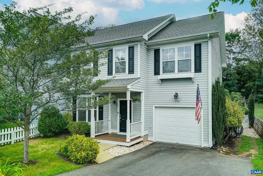 Welcome to this stunning end-unit townhome in desirable Wayland's Grant, perfectly positioned just minutes from downtown Crozet and only 15 minutes to Charlottesville. Step through the covered front porch into a beautifully maintained home featuring luxury vinyl plank flooring and neutral paint throughout. The formal dining room showcases a new dimmable chandelier, while the spacious living room boasts a gas fireplace with birch logs and painted shiplap accent wall, plus sliding doors to your private patio with canopy shade. The updated kitchen delights with solid wood cabinets, granite countertops, stainless steel appliances, breakfast bar, and pantry storage. Upstairs, the owner's suite offers a walk-in closet and ensuite with double vanity, soaking tub, and separate shower. Three additional bedrooms share a full hall bath, while the large laundry room includes LG washer/dryer and utility sink. A cozy loft with built-in bookcases creates the perfect reading retreat. Outside, enjoy the professionally landscaped, fenced backyard with multiple raised garden beds and one-car garage with storage cabinets. LED lighting and white blinds complete this energy-efficient home.,Granite Counter,Oak Cabinets,Wood Cabinets,Fireplace in Great Room