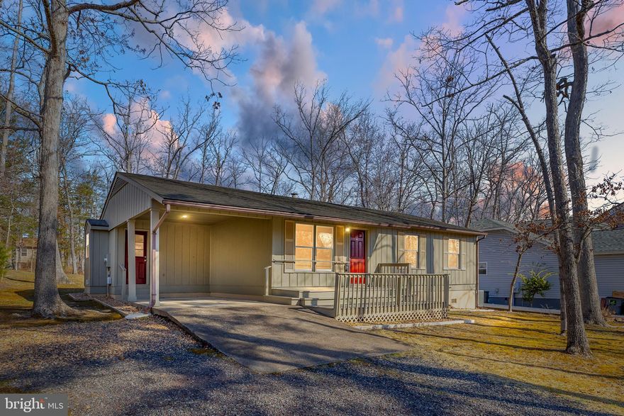 Charming 3-Bedroom Ranch with Modern Updates! Welcome home to this delightful 3-bedroom, 1.5-bath updated ranch, offering convenient one-level living in a fantastic location! The spacious eat-in kitchen features granite countertops, stunning wood cabinetry, stainless steel appliances, Fireplace and a French slider leading to a large deck and backyard—perfect for entertaining! Enjoy the warmth of beautiful wood floors throughout and upgraded baths with stylish tile. A separate laundry/mudroom adds extra convenience, while the attached carport provides easy access and protection from the elements. Major updates include a brand-new HVAC system (2023) and a 50-year shingle roof (2015) for peace of mind. Don’t miss this move-in-ready gem—schedule your showing today!