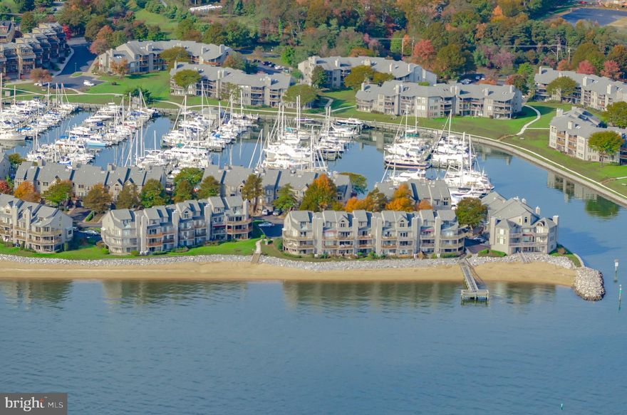 Open House 3/23 Sunday is cancelled. Home is under contract. Waterfront Charm & Modern Comfort in Chesapeake Harbour. Discover the perfect blend of coastal elegance and innovative design in this beautifully updated 2-bedroom, 2.5-bath waterfront condo with a spacious loft—ideal as a third bedroom, home office, or retreat—in the highly sought-after gated community of Chesapeake Harbour in Annapolis. Step inside to a light-filled living space centered around a fireplace with a designer beveled mirror outlined in stone, enhancing the natural light and creating a sense of spaciousness. The chef-inspired kitchen features granite countertops, stainless steel appliances, a generous island, new hardware, and stylish fixtures—perfect for everyday living and entertaining. Enjoy seamless indoor-outdoor living with balconies. The deck off the primary bedroom and living room offers ample space for outdoor dining, morning coffee, or sunset cocktails with scenic views. A second balcony provides even more space to soak up the fresh air.
The primary suite includes custom-designed California Closets that are sleek and highly functional. The versatile loft offers plenty of flexibility with the built-in Murphy bed and the streamlined desk, which provides guest space and a creative workspace. This floor plan offers a third-floor bathroom and a large closet with built-ins. Additional highlights include newer bath fixtures and a laundry center. Fresh paint and updated doors and hardware have been added.
Enjoy resort-style amenities, including two pools, tennis courts, private beaches, a marina, walking trails, and an on-site waterfront restaurant—all just minutes from Historic Downtown Annapolis.
Whether you are looking for a full-time residence or a stylish weekend getaway, this turnkey condo brings the best of Chesapeake Bay living to your doorstep. Call Trident Marine Group for info on  Chesapeake Harbour Marina.