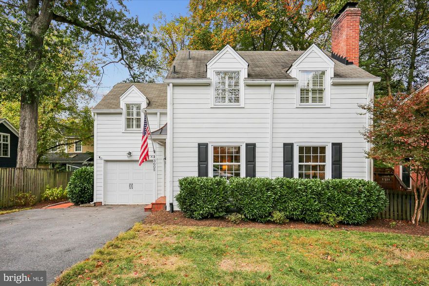 OPEN SUNDAY 1-3pm. Tucked along a picturesque, tree-lined street in one of Chevy Chase’s most desirable and walkable neighborhoods, this charming Colonial perfectly blends timeless character with modern comfort. Thoughtfully renovated and expanded in 2019, the home offers five bedrooms and four full baths, including a main-level bedroom suite and a beautifully landscaped, fully fenced rear yard.

A welcoming foyer and living room set the tone with abundant natural light from three walls of windows and a classic wood-burning fireplace. The heart of the home is the chef’s kitchen, showcasing quartz countertops, custom cabinetry, and premium appliances-KitchenAid French-door refrigerator, gas range with griddle, Bosch Emerald Pro dishwasher, and Azure wine fridge. A large island with ample seating, connects seamlessly to the family room addition which has a custom built-in banquette, while sliding doors open to a deck ideal for outdoor dining and relaxation.

Entry from the attached one-car garage leads to a mudroom with cubbies, providing everyday convenience and organization. Privately tucked away, the main-level bedroom suite with beautifully renovated bath is perfect for guests, an office, or multigenerational living.

Upstairs, the generously sized primary suite offers a spa-inspired bath, walk-in closet with custom shelving, and views of the backyard. Three additional bedrooms include one with an en-suite bath and two sharing a hall bath.

The lower level features a cozy recreation room with fireplace and built-ins, laundry, and generous storage space. Outdoor upgrades include a deck (2019), brick patio and front steps by Capitol Hardscapes (2020), and a new garage door (2024).

Moments from Chevy Chase Lake, the Purple Line, Rock Creek Park, and the North Chevy Chase Swim Club, this exceptional home delivers modern updates, classic design, and a beloved neighborhood setting.