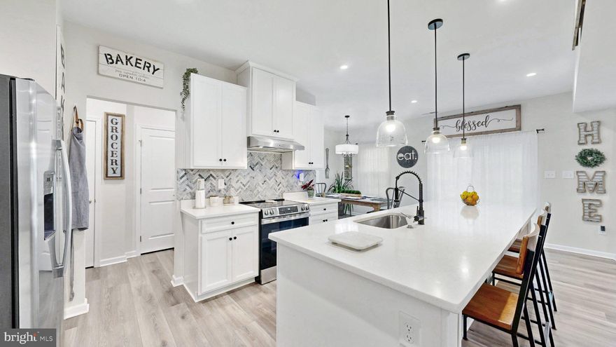 Welcome to this beautifully maintained 2024-built home in the sought-after community of Ovations in Clayton now offered at an even more compelling value. This 4-bedroom, 2.5-bath home features a bright, open-concept layout designed for both everyday living and easy entertaining. A versatile flex room at the front of the home provides the perfect space for a home office, sitting area, or playroom. The kitchen blends style and function with quartz countertops, stainless steel appliances, and a large center island that anchors the main living space and creates a natural gathering point. Upstairs, the spacious primary suite offers an oversized walk-in closet and a private bath with a Roman shower. Three additional bedrooms and a conveniently located second-floor laundry complete the upper level. Why wait for new construction when you can move right into a nearly new home with thoughtful upgrades already in place? With its updated price and prime location close to shopping, dining, and everyday conveniences, this is an opportunity you won’t want to miss.