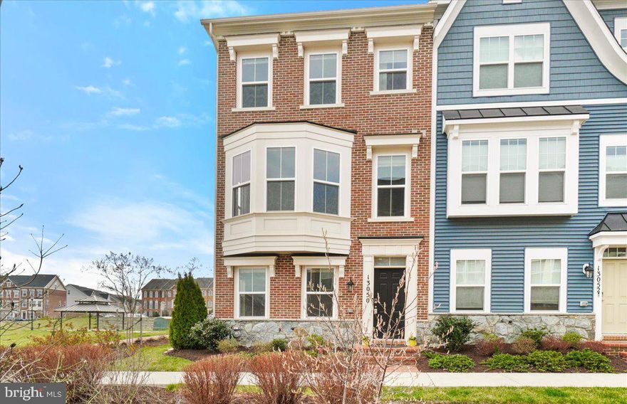 Impeccably maintained 4-year young, end unit townhome in Clarksburg Town Center.  Entry level flex room and 1/2 bath w/ access to 2 car garage w/ 50A 240V outlet for EV charger.  Main level has open concept kitchen, dining room and living room and access to deck. Gourmet kitchen had SS appliances, soft close cabinets and sliding cabinet storage. 3rd floor has primary bed and bath with WIC, 2 additional bedrooms and full bath.  Top floor has bonus room/4th bedroom w/ skylight and full bath. Hunter Douglas cordless shades throughout.