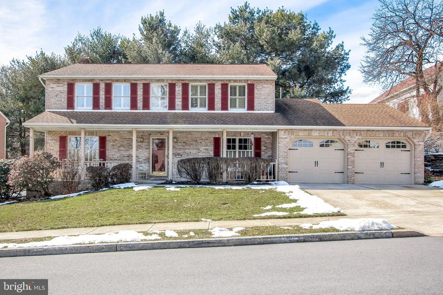 Wow!  4 bedroom, 2/2 bath, Brick Colonial Charmer in Camp Hill.  Enter in the foyer with hardwood floors, to the living room and separate dining room with white crown molding and chair rail.  Beautiful kitchen with updated cabinets, back splash, granite counter tops, light fixtures including under cabinet lighting, stainless steel appliances, island for food prep. and storage, and hardwood floors! Family room off kitchen complete with wood crown molding and chair rail, and gas fireplace.  Natural light abounds in this home! Mudroom on main floor complete with sink and laundry area.  Spacious master bedroom.  All bedrooms have ceiling fans. Main full bath has double sinks.  Plantation shutters throughout home.  Majority of basement is finished to kick back and relax, along with additional room for storage.  Deck and yard backs to mature trees for privacy.  Close to schools, shopping malls, and local parks.  Love Where You Live at 32 Paddock Lane!