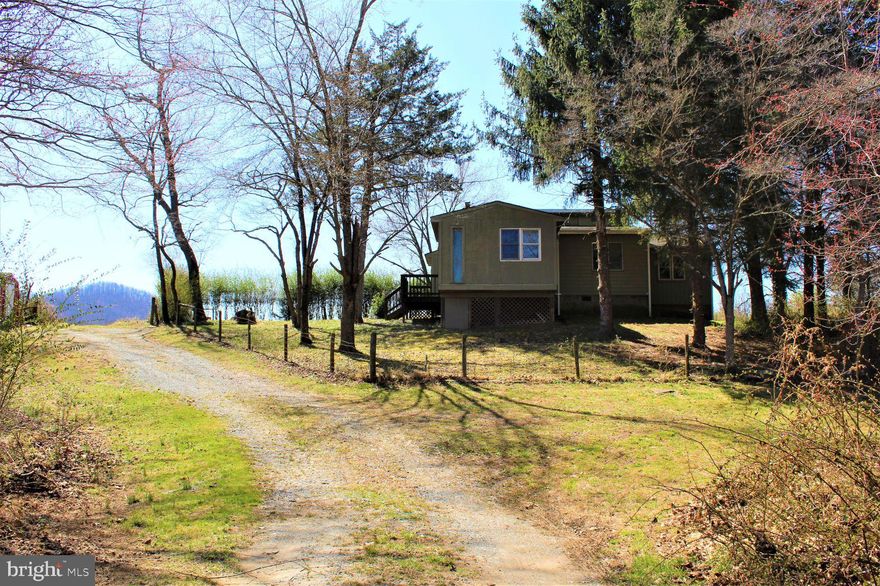 THIS PROPERTY IS JUST AMAZING !! Look no further you have it all right here.... If you are looking to get away from the Hustle & Bustle of City Life this is for you. Where else can you find 19.1 acres of open land, woods, year-round creek & a cabin right off Rt. 29 on the border of Culpeper & Madison County line. NO HOA, No Covenants, Start a garden, Bring the horses, chickens, goats, etc., and start your own little Homestead...Live in the cabin while you build your Dream Home at the foot of Thoroughfare Mountain and afterward you will have a great get-a-way for family & friends to come to visit and hang out in the cabin... Or maybe even have your own little Air B & B, just a thought. This property is literally, right around the corner from Prince Michel Vineyards & Tap 29 Brewery along with many other Wineries in the area plus Graves Mountain Log with many activities throughout the year. Do you like hiking? Old Rag Mountain is only about 15 minutes away along with Skyline Drive not much further up the road. Madison & Culpeper are only about 8 miles away, Charlottesville about 30 mins and Northen Va. & D.C area about 90 min. So what are you waiting for, make an appointment today..... Property is in Land Use at this time. Buyers will be responsible for all Roll Back Taxes if not kept in Land Use moving forward. The cabin is being sold As-Is & the Value is in the land.