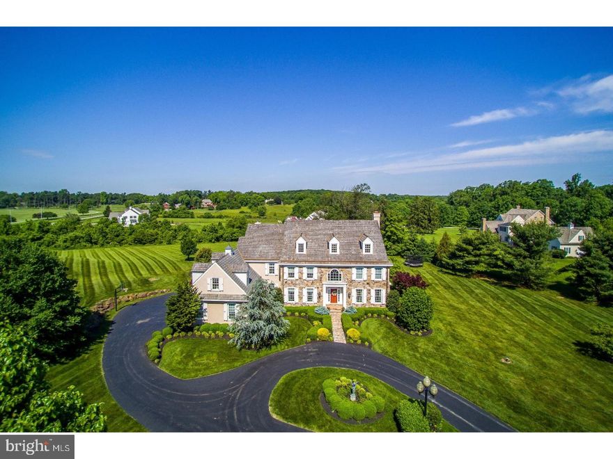 Built with a discerning eye for detail and meticulously maintained by the owners, 1 Steeplechase is a seamless transition into a fabulous new home. Enjoy the beauty, privacy and country-like feel afforded by living on 4 lush acres, while sharing a lovely lane with only 10 neighbors and conveniently accessing amenities nearby! The prime location is just a mile from Radnor Hunt, close to highways, Great Valley schools, country clubs, shopping and dining destinations. Upon approaching the circular drive, elegance awes you with a stone exterior and pristine landscaped grounds. Every window offers a magnificent scenic view. Watching the equestrians and horses of Radnor Hunt ride through the rolling hills in the back fields, the open space of green grass on a spring day, the leaves changing on the trees in the fall, and occasional snow fall on the large oak tree just outside the kitchen window truly never gets old. Sunsets are fiery and brilliant, especially when dining and entertaining in the outdoor room with a wood-burning fireplace. Meticulously updated throughout, this very spacious, comfortable home is brimming with upscale features and will exceed your expectations. High ceilings, site-finished hardwood floors, generous oversized light-filled windows, a 2-story center hall with motorized chandelier for easy cleaning, a 3-stop elevator, 3+ fireplaces, state-of-the-art gourmet kitchen with soapstone counters & marble backsplash, great room, family room, den/study, premium home theatre with reclining seats for 7, and Zen rear patio meet your family's every need and then some. Whether for large-scale gatherings, outdoor parties, special occasions or quiet evenings, this gem graciously accommodates it all. Sleeping quarters are wonderful and peaceful, particularly the master suite with a spa-inspired marble bath. Three additional bedrooms are well-proportioned, with a total of 4.2 baths. The lower level can be accessed from both the interior and the large 3-car garage. Relax outdoors as you take in the breathtaking vistas.