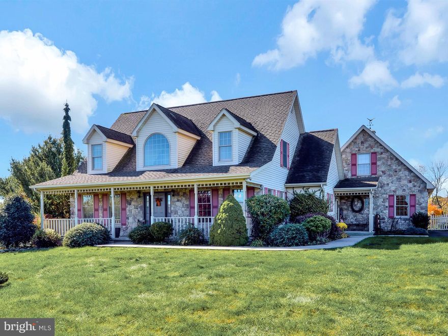 Beautifully situated on a one acre lot in the Blue Mountain School District, this modern adaptation of the traditional Cape Cod/Farmhouse style home will check off all your must haves on your house hunting checklist. The interior offers 2,300+ square feet of above grade living space with 3-4 bedrooms and 2.5 baths under two stories. The design features a dramatic two story foyer that opens to the vaulted ceiling great room complete with stone surround fireplace, highlighted on both sides with custom built-ins, and a wall of french doors to the rear covered porch and yard.  The country style kitchen with Corian countertops and center island includes a bayed window breakfast/dining area and easy access to the formal dining room. The master bedroom suite is conveniently located on the first floor and fully occupies one wing of the home with private bath and walk-in closet. The second story staircase overlooks the great room and is flanked by the two additional bedrooms. The two car attached garage is located to the side rear of the home for uninterrupted sight lines and a small porch is nearby providing access to the laundry room and a separate staircase to the large, fully finished bonus room above the garage. The lower level of the home adds additional living space and  includes an oversized family/game room with fireplace and a separate utility/storage room.  The exterior of the home is impressive with the trio of dormers above the covered front porch, fully fenced yard, kidney shaped in-ground pool, potting house, and storage shed.