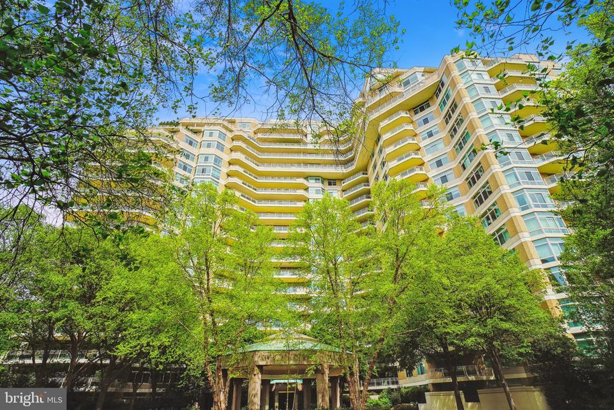 Beautiful 2-Bedroom, 2.5-Bath Condo in an Elegant Building with Luxurious Amenities!  This spacious condo offers serene views of lush surroundings and a prime location just steps from restaurants, shops, and the Metro.  Enjoy a bright and open layout with large windows and a spacious living/dining area.  The well-appointed kitchen features table space and includes a washer/dryer.  The primary suite boasts lovely views and a large en-suite bath, while the second bedroom has an attached bath.  Additional features include a powder room, elegant front desk and doorman services, and abundant guest parking.  Amenities include indoor and outdoor pools, tennis, racquetball, basketball, a Pilates room, a full gym with an attendant, a sauna, and a spa-like atmosphere.  Perfect for those seeking luxury living with convenience and style!