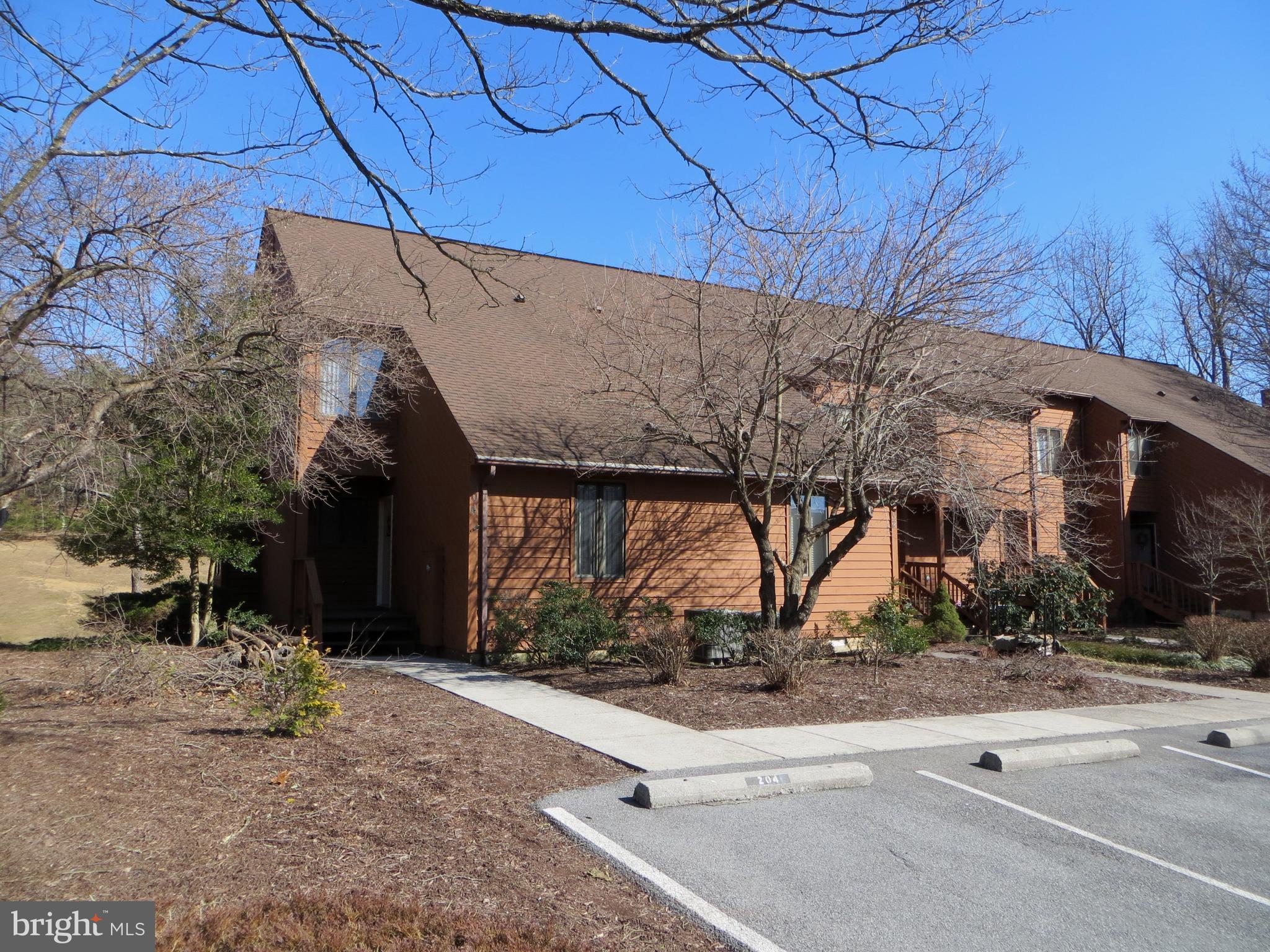 Well maintained 2 level end unit townhome, overlooking the 17th Green of Golf Course. Gorgeous upgraded kitchen with new upgraded cabinets, appliances and granite counter tops.Opens to dining area and large living room with wall to wall carpeting and glassed-in fireplace. Slider to spacious deck and outdoor storage room. Main level bedroom has 2 closets, and full bathroom. Upstairs master bedroom has vaulted ceiling, 2 closets (1 is a walk-in), skylight in bathroom with separate tub and shower and slider to open deck with golf course view. Hallway has linen closet and closet with washer and dryer. Upstairs guest bedroom has 2 closets, a full bathroom and huge attic storage. Lennox Heat pump and water heater replaced 4 years ago. TRCA covers exterior maintenance. Home in walking distance to amenities. Selling furnished (see list).Class A FAMILY membership is available with a $5350 initiation fee. Annual club dues are $2300.Private Club Amenities are not owned or operated by the HOA nor are their dues included in the HOA fees. Private Club Amenities include: Golf (Greens Fees), Driving Range, Chipping Green, Putting Green, Indoor Sports Center (racquetball, indoor pool, gym, aerobics room, laundry facilities, sauna, steam room, whirlpool, volleyball,indoor & outdoor tennis, indoor & outdoor basketball, shuffleboard, pickleball) , 2 Outdoor Pools, Clubhouse, Club Room, Baseball Field, Playground, Fishing Ponds. Other onsite amenities include: The Clubhouse Grille & Pub and the Sleepy Creek Spa & Salon. Tomahawk Ridge Cluster Association has an annual fee of $1500. for exterior building maintenance, grounds maintenance and street lighting.