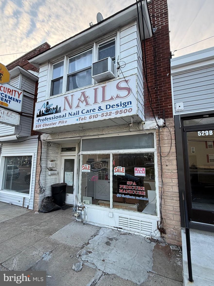 Mixed-use investment opportunity on high-traffic Chester Pike. First floor commercial space currently configured as a nail salon with strong visibility and signage potential. Second floor features a large 2-bedroom apartment with rooftop access.

Ideal for investors or owner-operators seeking income potential and flexibility for various business uses. Prime location with consistent traffic flow and close proximity to major routes, shopping, and transit.

Property being sold as-is. Buyer responsible for all inspections and certifications.