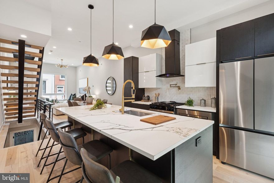 Welcome to your dream home in the heart of Point Breeze, Philadelphia! This stunning new construction offers the perfect blend of modern sophistication and timeless charm. As you step inside, you will be greeted by a spacious and open floor plan that is flooded with natural light. The main level features a beautifully designed gourmet kitchen, complete with high-end stainless steel appliances, quartz counter tops, and ample storage space. The kitchen seamlessly flows into the elegant dining area, creating the ideal space for entertaining family and friends. The living area is the epitome of comfort and style, boasting large windows that showcase the picturesque views of the neighborhood. This space is perfect for relaxing after a long day or hosting gatherings for loved ones. Upstairs, you will find a luxurious main suite that is a true retreat. The master bedroom offers a tranquil oasis with a walk-in closet and a spa-like ensuite bathroom, complete with a soaking tub, dual vanities, and a spacious shower. Three additional bedrooms and two full bathrooms provide plenty of space for your family or guests. This home also features a private rooftop deck, where you can enjoy breathtaking city views and create lasting memories with loved ones. It is the perfect spot for summer barbecues, stargazing, or simply unwinding after a busy day. In addition to its impeccable interior, this new construction offers a prime location in the highly sought-after Point Breeze neighborhood. Property comes with a 10yr tax abatement