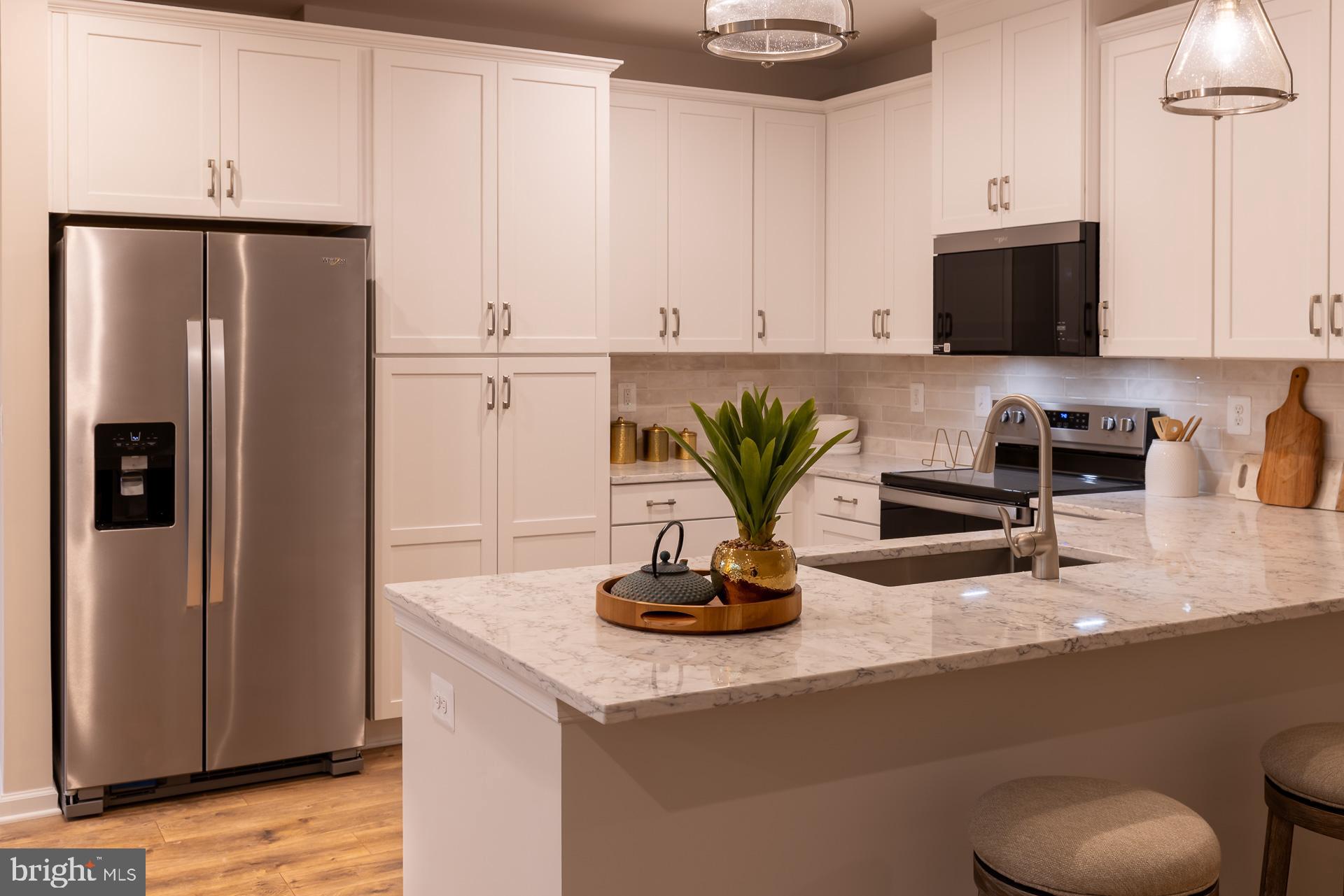 Find Your Perfect Fit at Gatherings at Cabin Branch. Whether you're looking to elevate, downsize, or rightsize your lifestyle, this 55+ community in Clarksburg offers the perfect balance of comfort and convenience. Choose from five stylish condo floorplans with elevator access and enjoy amenities like a billiards room, gym, golf simulator, and more. Join community events at the clubhouse or explore Clarksburg Outlets for shopping and dining. At Gatherings at Cabin Branch, you’ll be close to everything that matters most—daily conveniences, top-tier amenities, and cherished connections. Effortless One-Level Living at The Village at Cabin Branch. Discover the ease of single-level living in the Cambrose floorplan, a spacious one-bedroom home in the sought-after 55+ community of The Village at Cabin Branch. Designed for comfort and convenience, this open-concept layout features a bright living and dining area, a modern kitchen with ample cabinetry and a large pantry, and a serene primary bedroom with generous closet space. Relax on your private balcony or explore the community’s exceptional amenities, including a clubhouse, fitness center, golf simulator, movie room, game room, yoga studio, cardio gym, and scenic walking trails. Plus, enjoy energy savings with our ENERGY STAR® certified and Indoor airPLUS qualified homes. ** Photos of the model home. * This price reflects the base price of a to-be-built home of the same model. *Pricing, features and, availability subject to change without notice. MHBR No. 93 2023 Beazer Homes.
