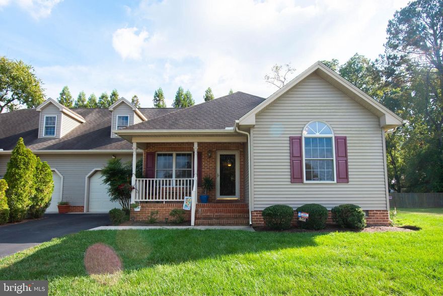 This well maintained 3 bedroom/2 bathroom duplex is located on a quiet cul-de-sac street in Beckford Manor. A large and open living room with cathedral ceilings greets you as you enter, beyond that is a kitchen with new stainless steel appliances and ceramic tile backsplash, kitchen peninsula with a large sink and room for barstools and a dining area with sliding glass doors leading to the rear deck, and just around the corner is a private screened porch. The spacious primary bedroom has a nice walk-in closet and the full bath has double bowl vanity and a large walk in shower. The other 2 bedrooms and full bath are located on the other side of the home for added privacy. Through the laundry room is access to the huge, floored walk up attic with a window, which could be finished off for additional living space.