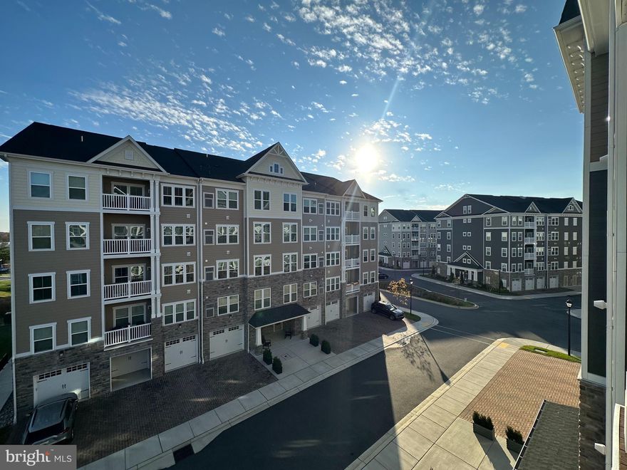 Welcome to 8940 Carls Court, a beautiful condominium in the Ellicott Retreat 55-plus community. This wonderful  2-bedroom, 2-bathroom front unit is located on the 4th floor.  An open-concept floor plan full of natural lights welcomes you once you enter the house. The gourmet kitchen features a gas stove, stainless steel appliances, quartz counters, and a breakfast bar.  The living and dining areas are spacious and open, and there is access to the private balcony. The sizable primary suite features 2 closets and an attached bathroom with a walk-in shower! The second bedroom has its own sitting area and an attached bathroom with a tub. Laundry is in the unit! An attached garage with an electronic opener, an electric car charging port, and an extra-long driveway set this unit apart from the others in the community.  As a resident of this active community, you will have access to the community clubhouse and fitness center! The community is also located near major commuter routes, shopping, and dining, 8940 Carls Court provides an ideal location for active adults seeking comfort, convenience, and a low-maintenance lifestyle. Schedule your showing today and experience all that this exceptional property has to offer!