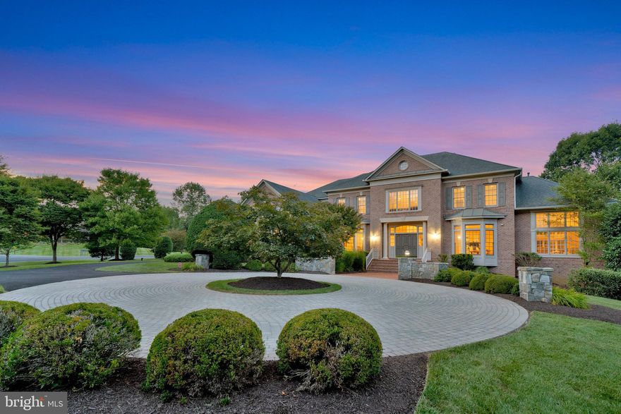 Welcome to this stunning Gulick-built Woodley Model, a home that has been meticulously maintained and thoughtfully updated.  The new screened porch is a highlight, featuring four heaters, ceiling fans and a built-in BBQ and collapsible folding, glass doors that transform the space into an additional room.  Inside, you’ll find 6 bedrooms, full baths and 2 half baths, along with elegant hardwood floors on the upper-level hallway, custom closets in the owner’s suite, and custom wine storage in the lower level.
The main level impresses with a dramatic two-story foyer with a curved staircase formal living and dining rooms with arched entryways, and a sunlit two-story conservatory and family room accented by a gas fireplace and columns.  The gourmet kitchen is a chef’s delight, complete with a breakfast area, second staircase and an adjoining sunroom.
The spacious owner’s suite is a retreat, featuring a sitting area, private balcony, expansive walk-in closet and a luxurious bath.  The walk-out lower level is designed for entertainment, boasting a wet bar, recreation/playroom, media room, wine cellar, exercise room with adjacent steam shower bathroom and an additional bedroom 
Outside enjoy vibrant landscaping, a private and peaceful patio, 3 car garage and a circular paver driveway.  Conveniently located near Great Falls Park and McLean, this home offers the perfect blend of luxury and location.