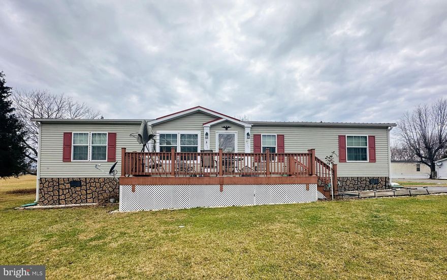 Discover the perfect blend of comfort and convenience in this beautifully maintained 2013 double-wide home nestled in the peaceful Whitacres Mobile Home Community. Offering 1,474 sq. ft. of open living space, this charming well maintained 3-bedroom, 2-bath home boasts an expensive new metal roof, two  newer expansive TREX decks (8x24 front and a 37x6 back deck with a wheelchair-accessible ramp), and a spacious, well-appointed kitchen perfect for cooking and entertaining. The master suite is a true retreat with stunning new hardwood floors, a large walk-in closet, soaking tub, double vanity and stand-up shower. Storage is no issue with three walk-in closets, a generous mudroom with a washer, dryer, extra storage space and second fridge (all conveying), and an oversized 12x20 shed with built-in shelves and a cabinet for all your tools, toys, or hobbies. The shed has lights that can be hooked up with an extension cord.  Sitting on a large lot with serene open field views, this home is conveniently close to shopping and amenities. Don’t miss your chance to own this move-in-ready gem—schedule your tour today! Lot rent is $350 per month ($400 starting in April). Being sold As Is! Finance through 21st Mortgage or other lender who offers land lease manufactured financing.